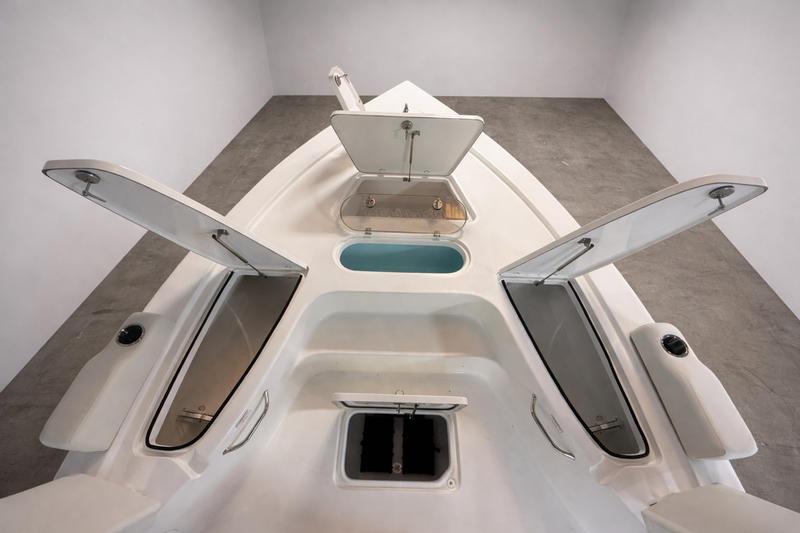 2026 Sea Pro 250 Bay boat interior with open storage compartments and sleek design.