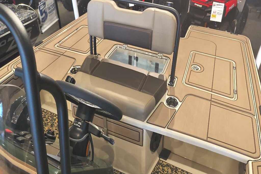 2026 Mako 18 Pro Skiff Backwater Edition boat interior with tan seating and steering console.