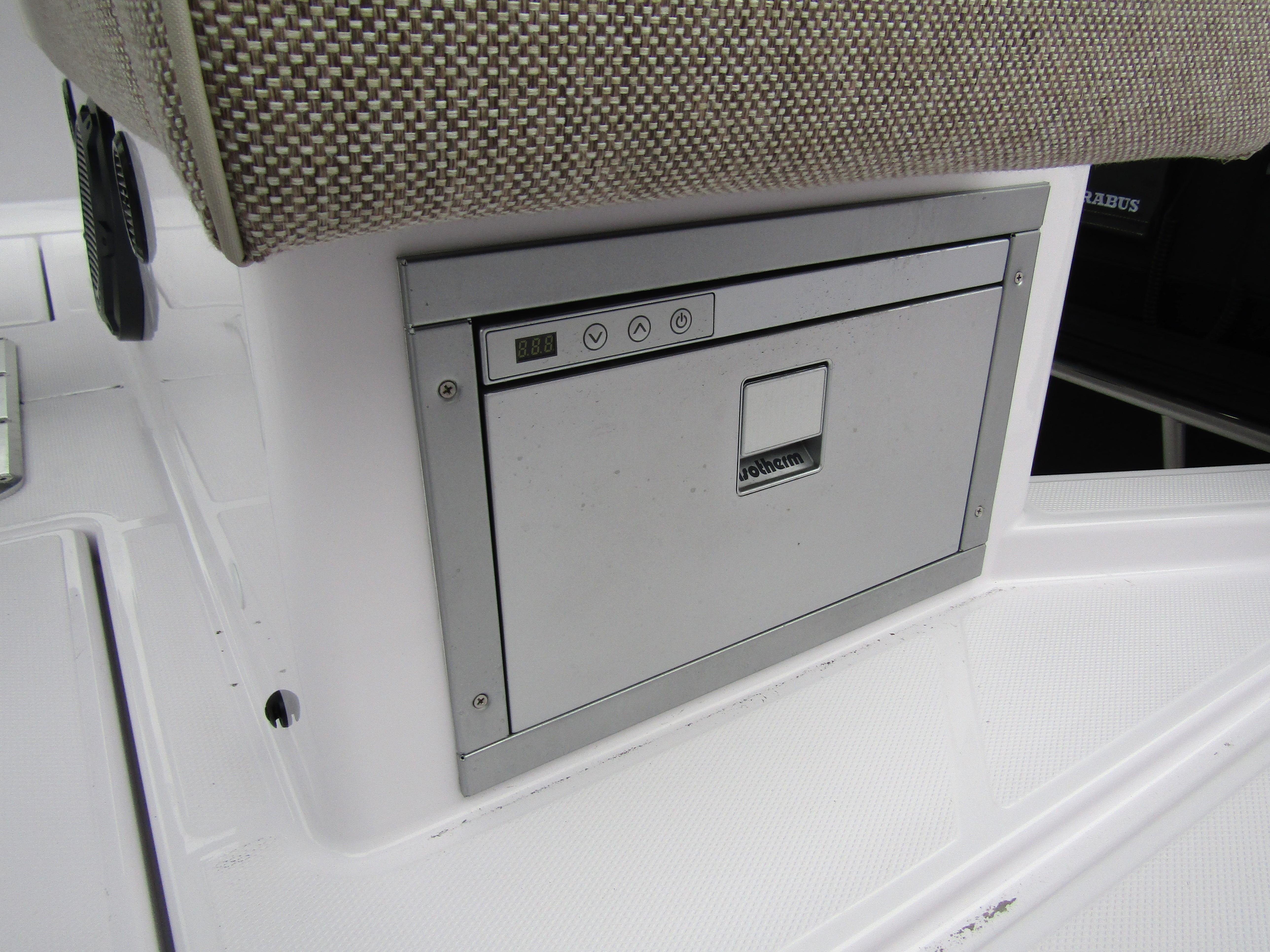 2024 Axopar 37 Sun Top boat interior with built-in storage compartment.
