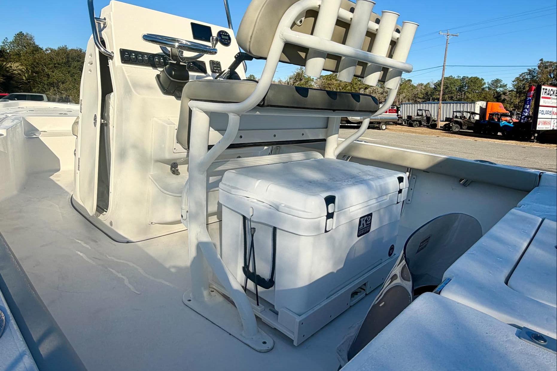 2026 Key West 210 Bay Reef boat interior with console, seating, and cooler.
