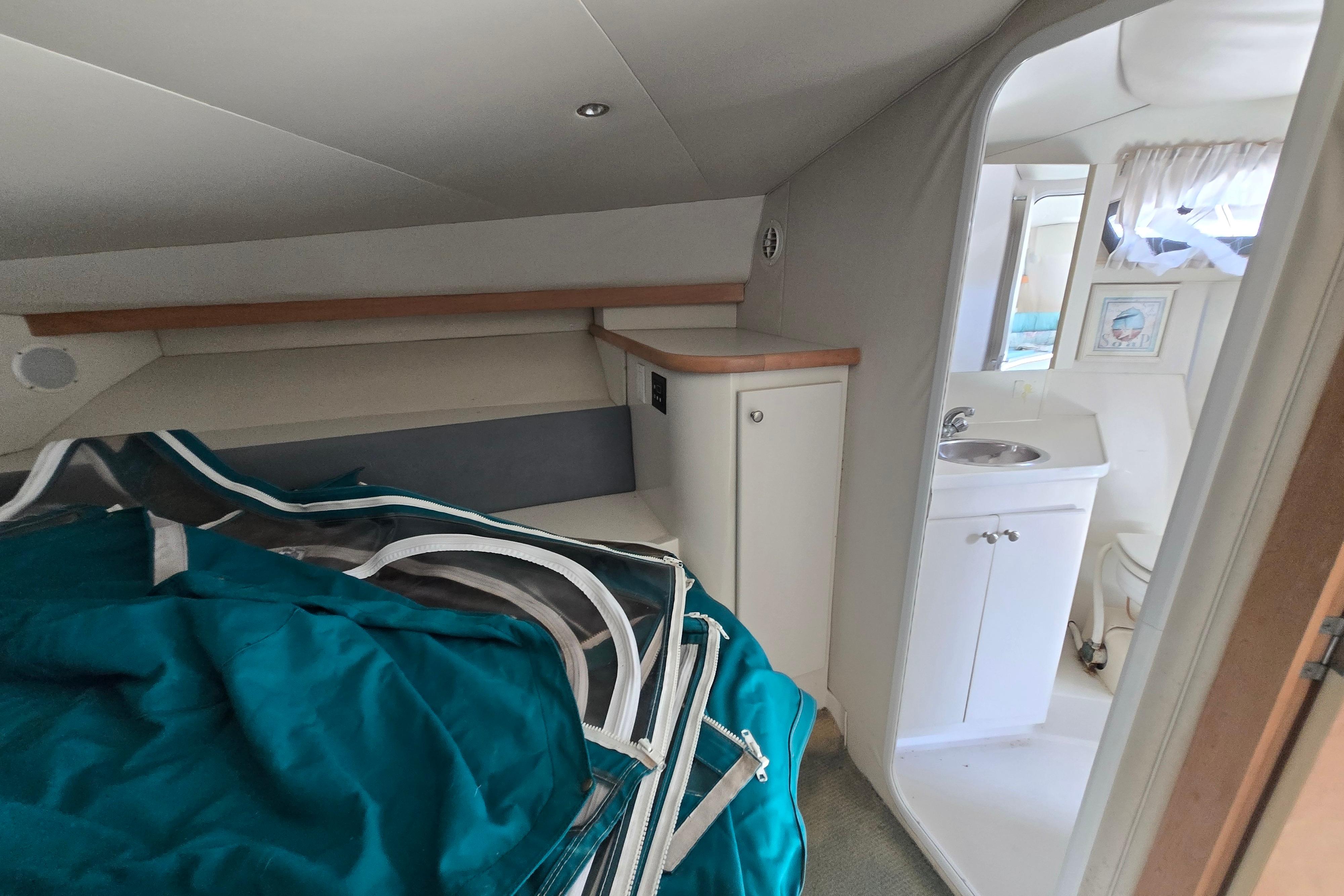 Interior of 1994 Carver 380 Santego yacht with bathroom and storage area.