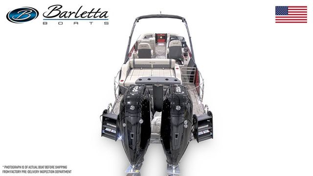 2025 Barletta Twin L25UCAT boat with dual engines, rear view, American flag displayed.