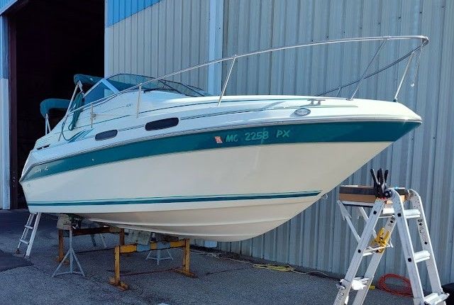 1994 Sea Ray 230 Sundancer boat in storage facility.