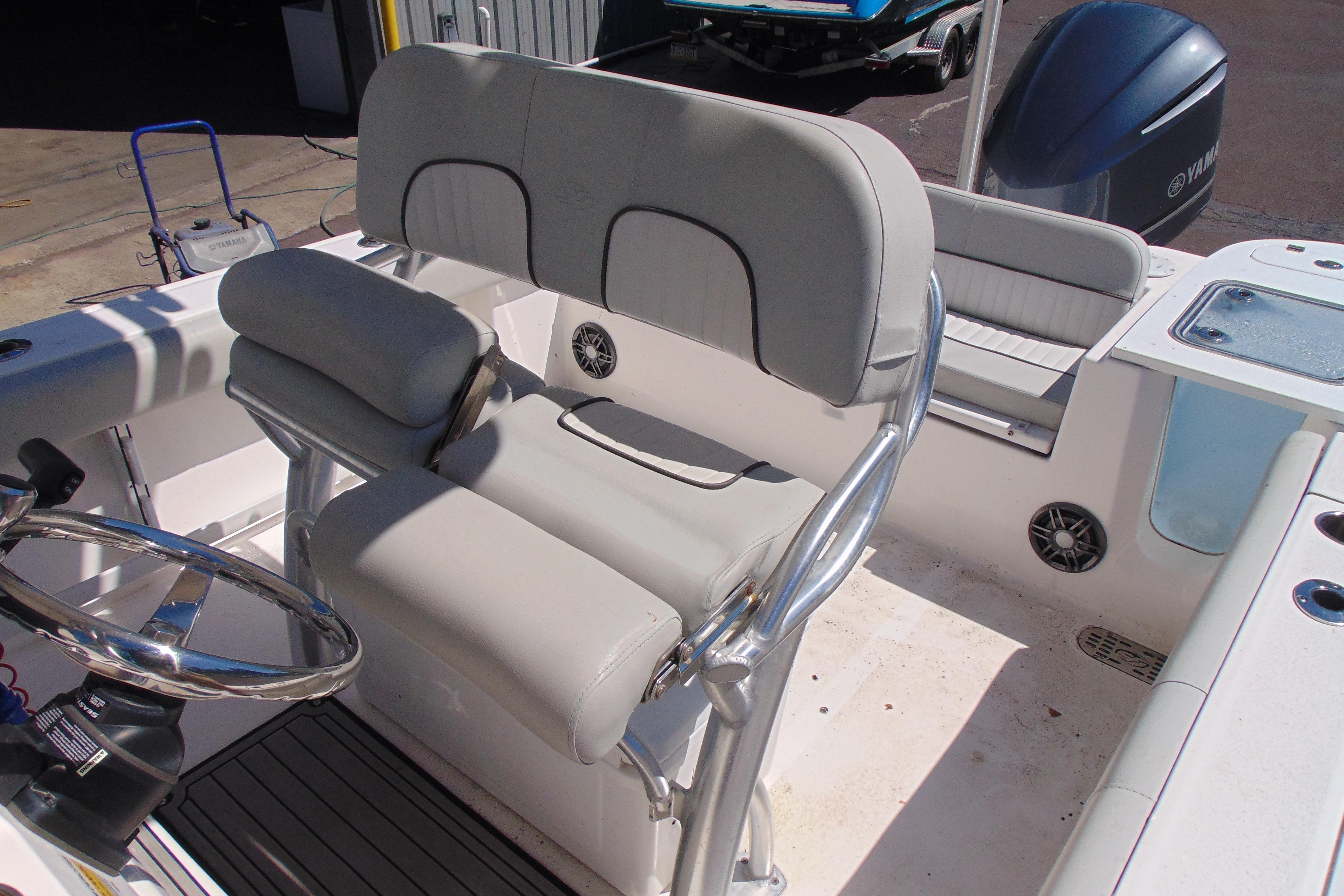 2022 Sea Fox 248 Commander boat interior with cushioned seating and steering wheel.