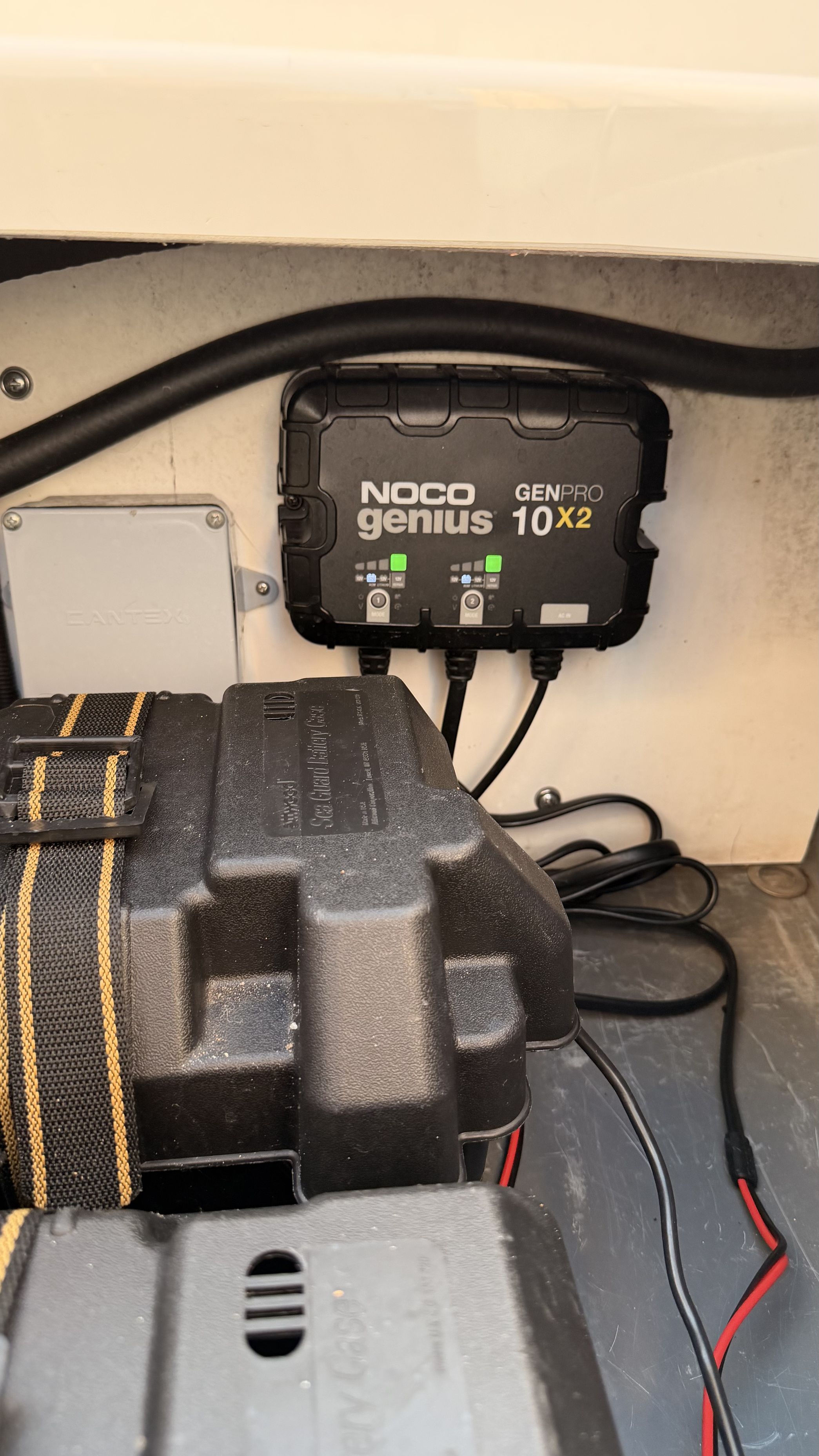 A NOCO Genius GENPRO 10X2 charger is installed in a boat.