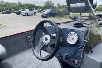 2026 Tracker Bass Tracker Classic XL boat dashboard with steering wheel and gauge.