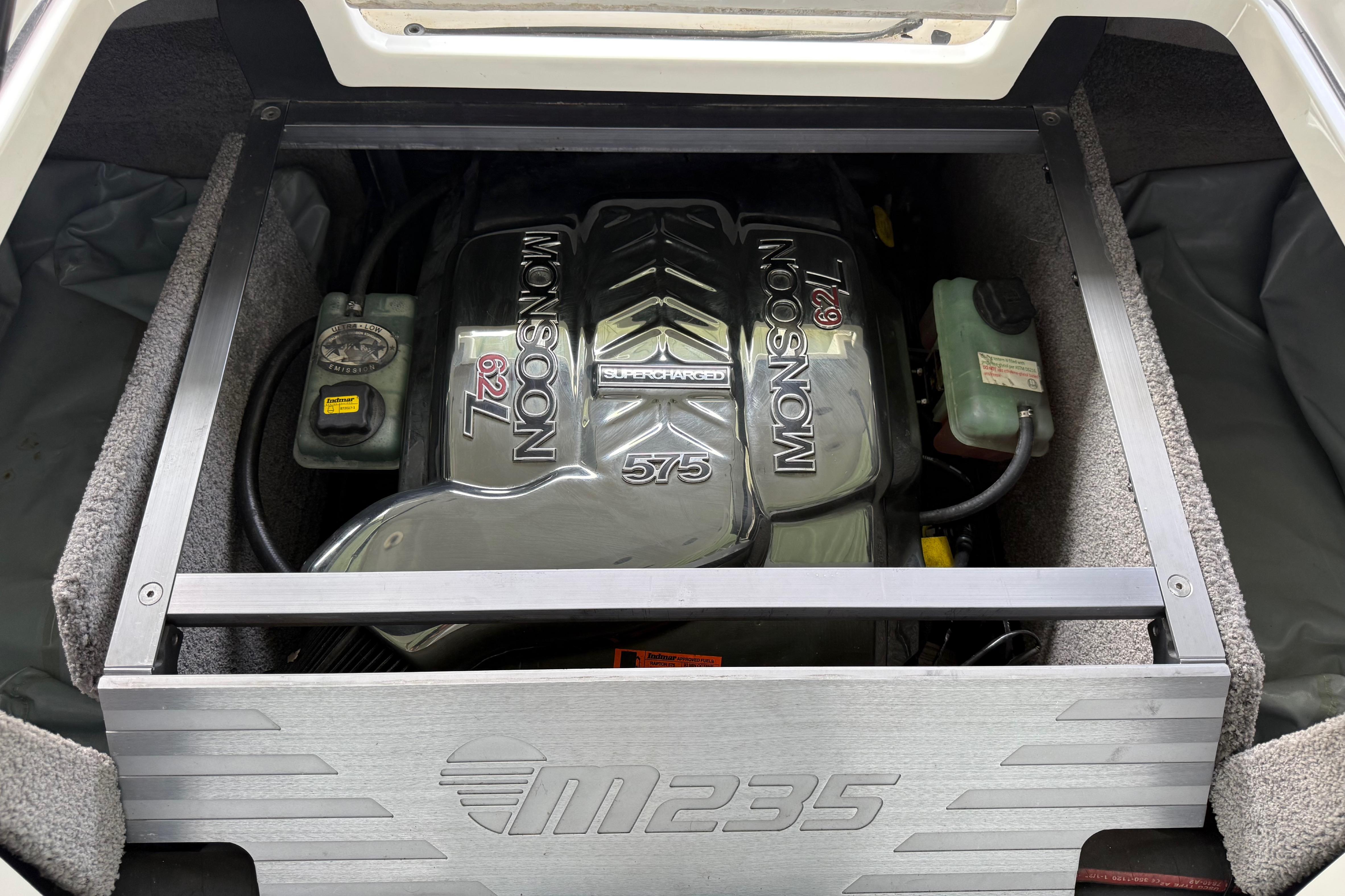 2017 Malibu M235 boat engine compartment featuring Monsoon 6.2L 575 horsepower engine.