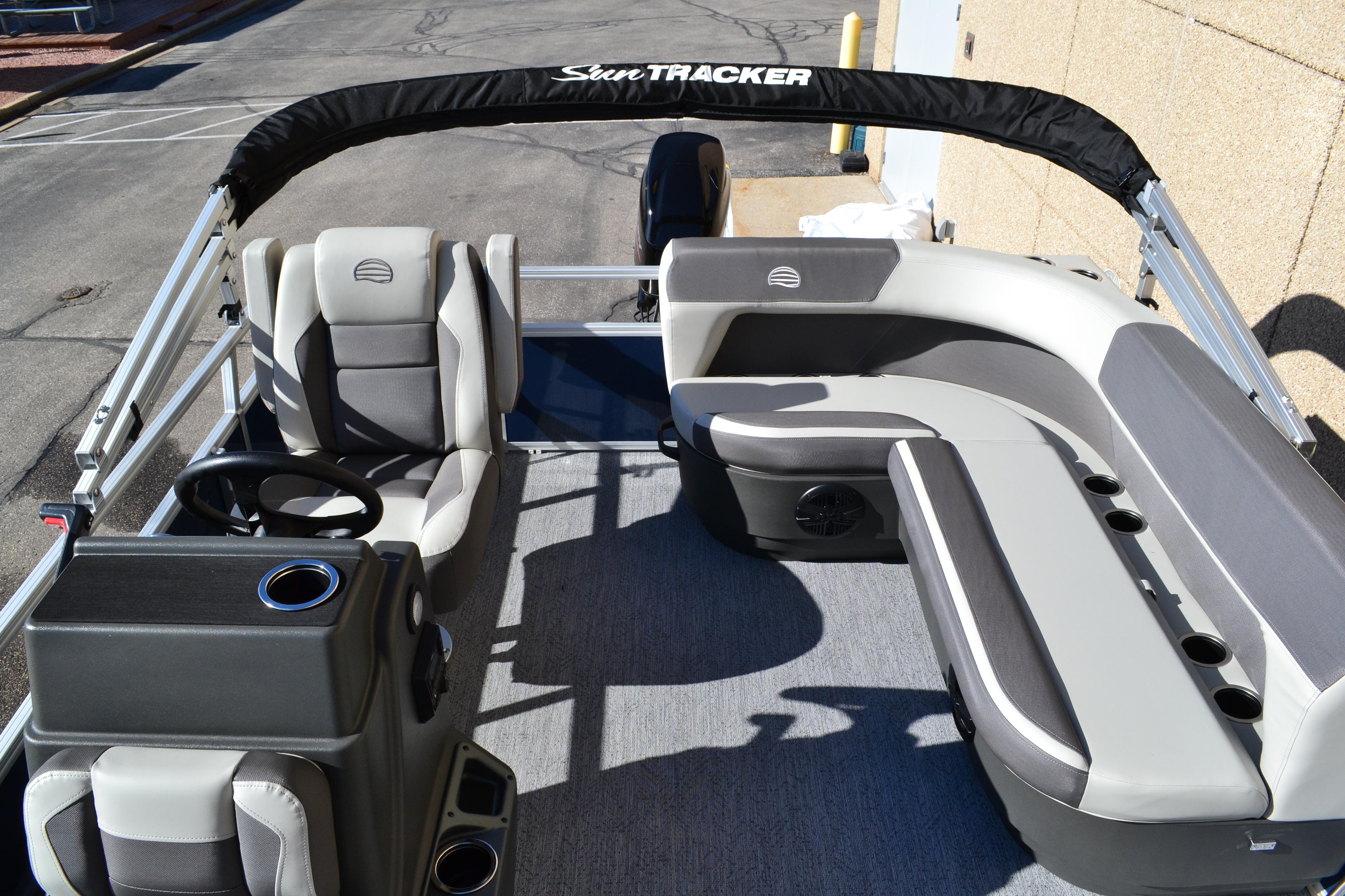 2026 Sun Tracker Bass Buggy 16 XL Select pontoon boat interior with seating and steering console.