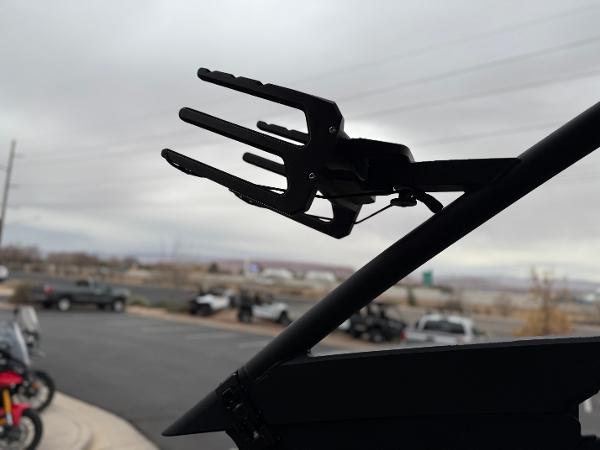 Wakeboard rack on 2025 Yamaha Boats 255XD against cloudy sky.