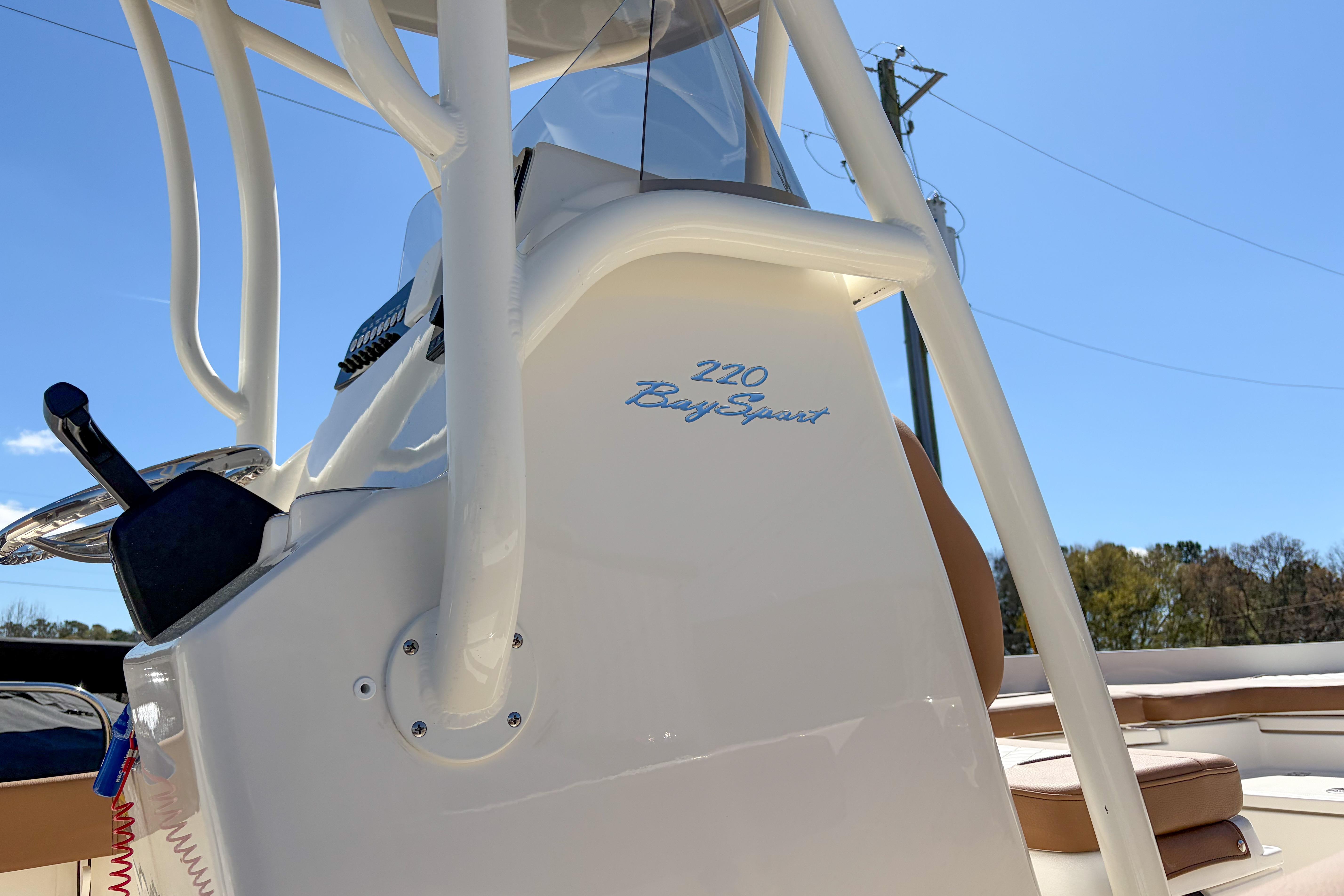 2026 Pioneer 220 Bay Sport boat console with clear blue sky background.
