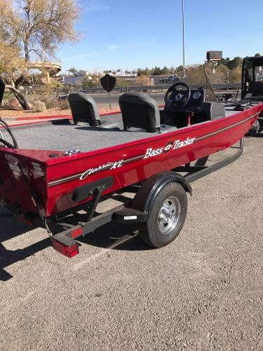 2025 Tracker Bass Tracker Classic XL boat, red, parked on a trailer.