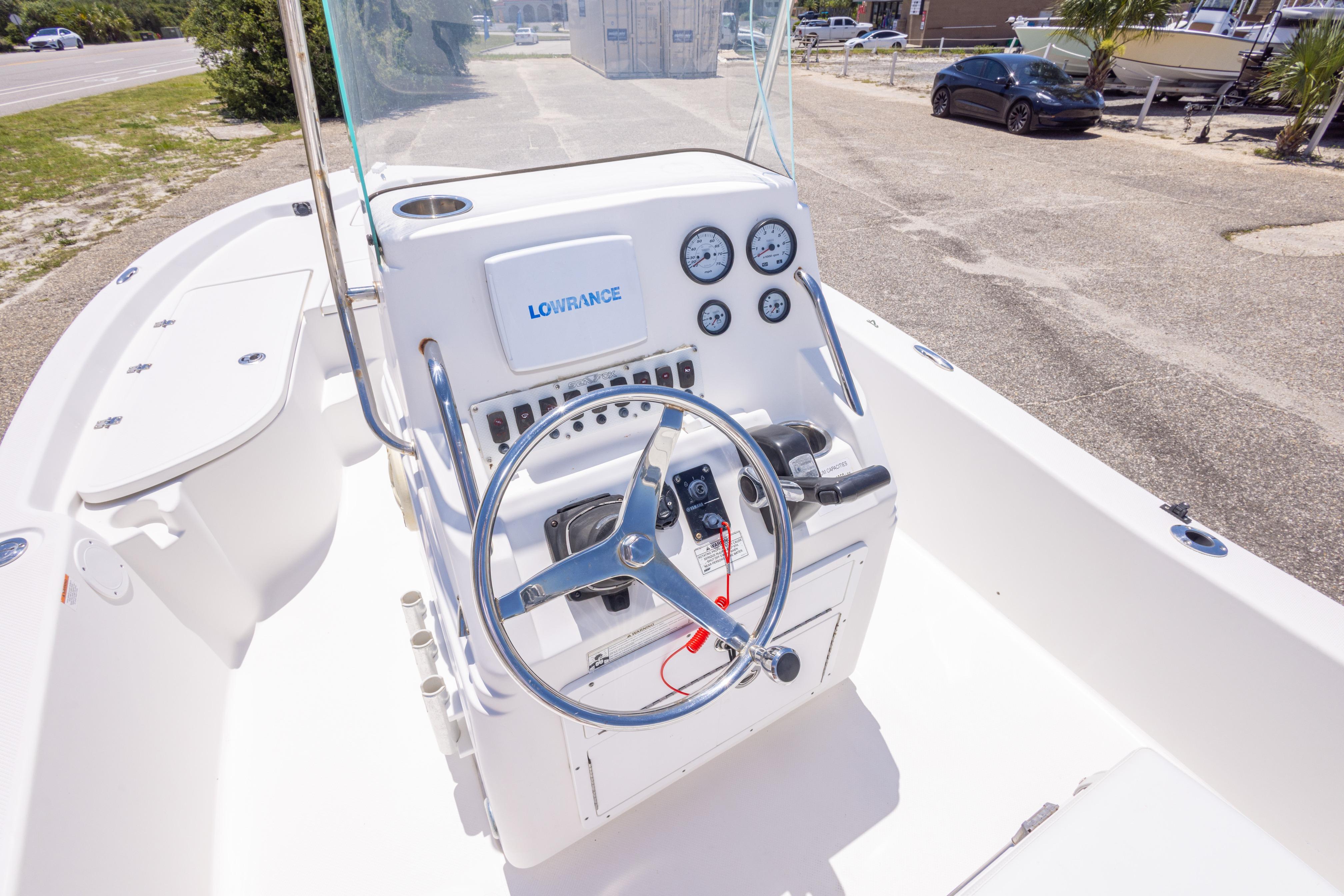 2011 Sea Fox 200XT boat dashboard with steering wheel and navigation instruments.