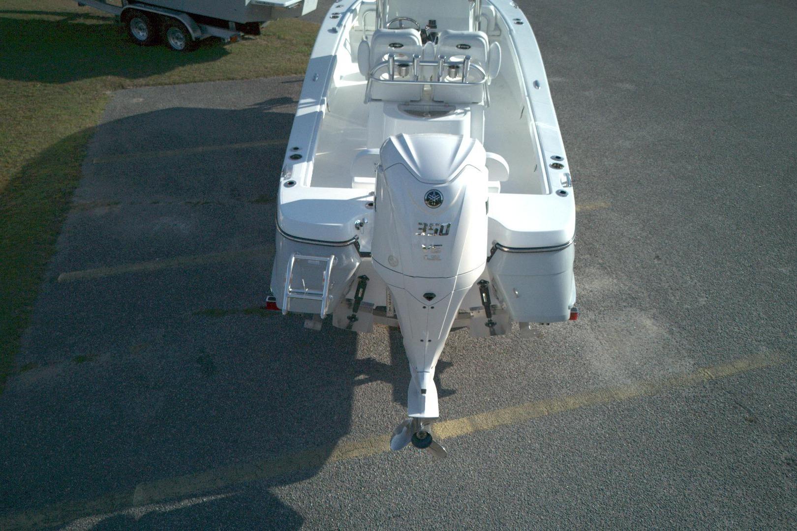 2026 BlackJack 256 Coastal boat with powerful outboard motor, viewed from above.