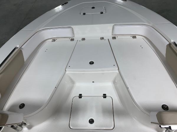 2026 Robalo 226 Cayman boat deck with storage compartments and seating.