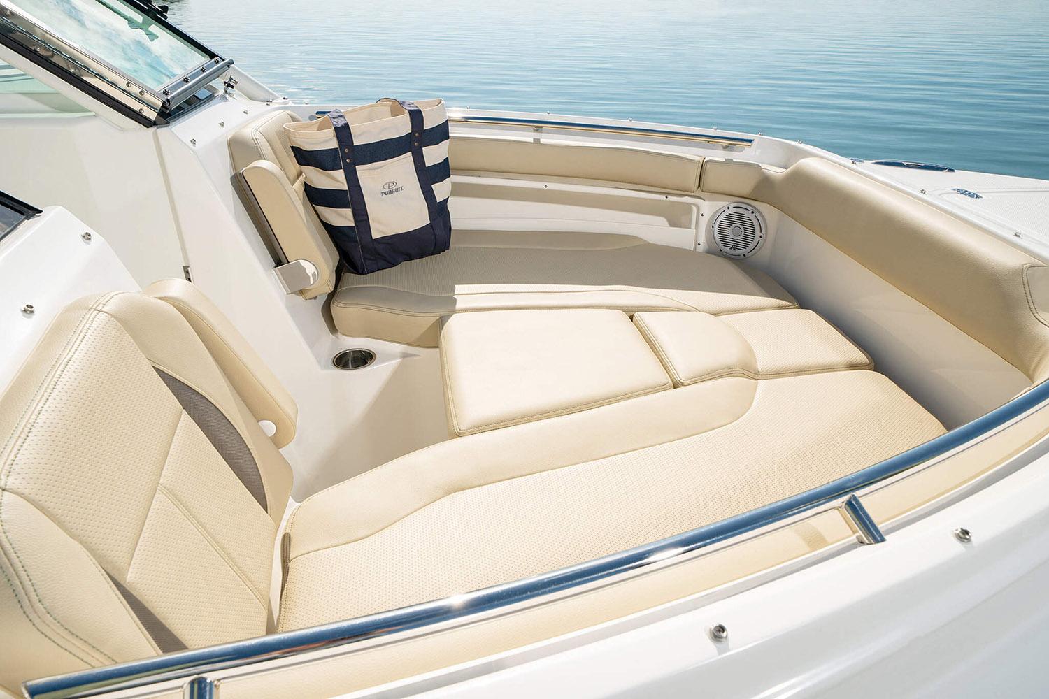 Manufacturer Provided Image: 2025 Pursuit DC 266 Dual Console boat interior with beige seating and nautical bag.