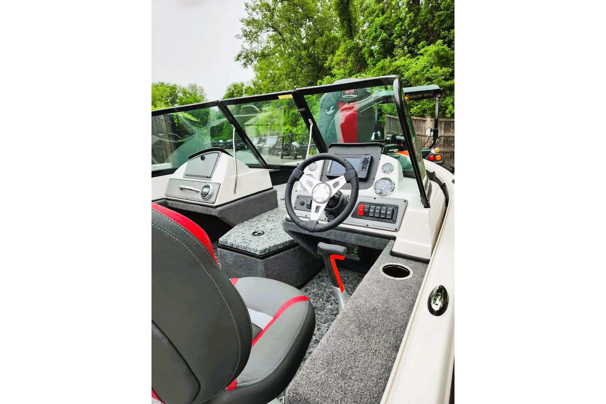 Interior of 2026 Ranger VS1682SC Reata boat, featuring modern dashboard and steering wheel.