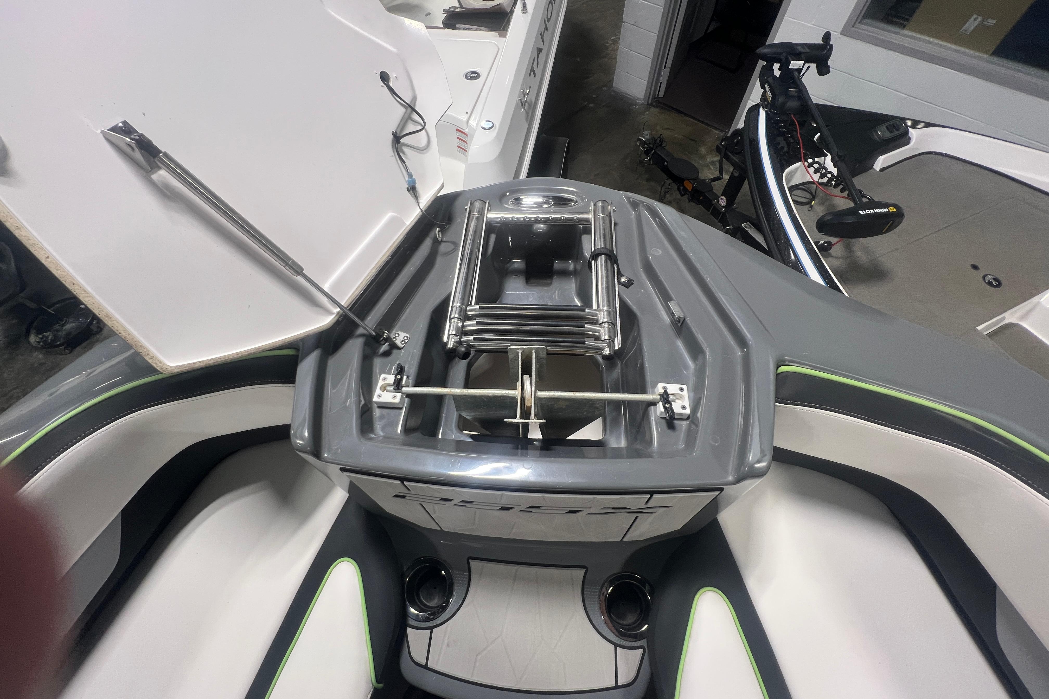 2021 Yamaha Boats 255XD interior with open storage compartment and sleek design.