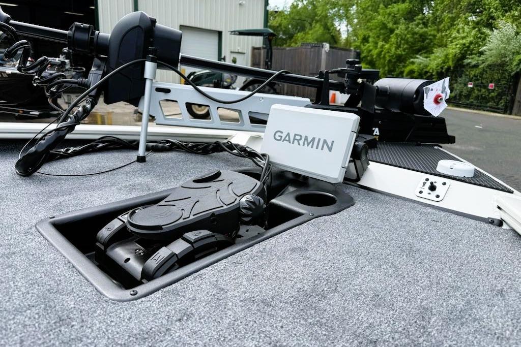 2025 Tracker Savage 215 boat with Garmin navigation system and trolling motor on deck.
