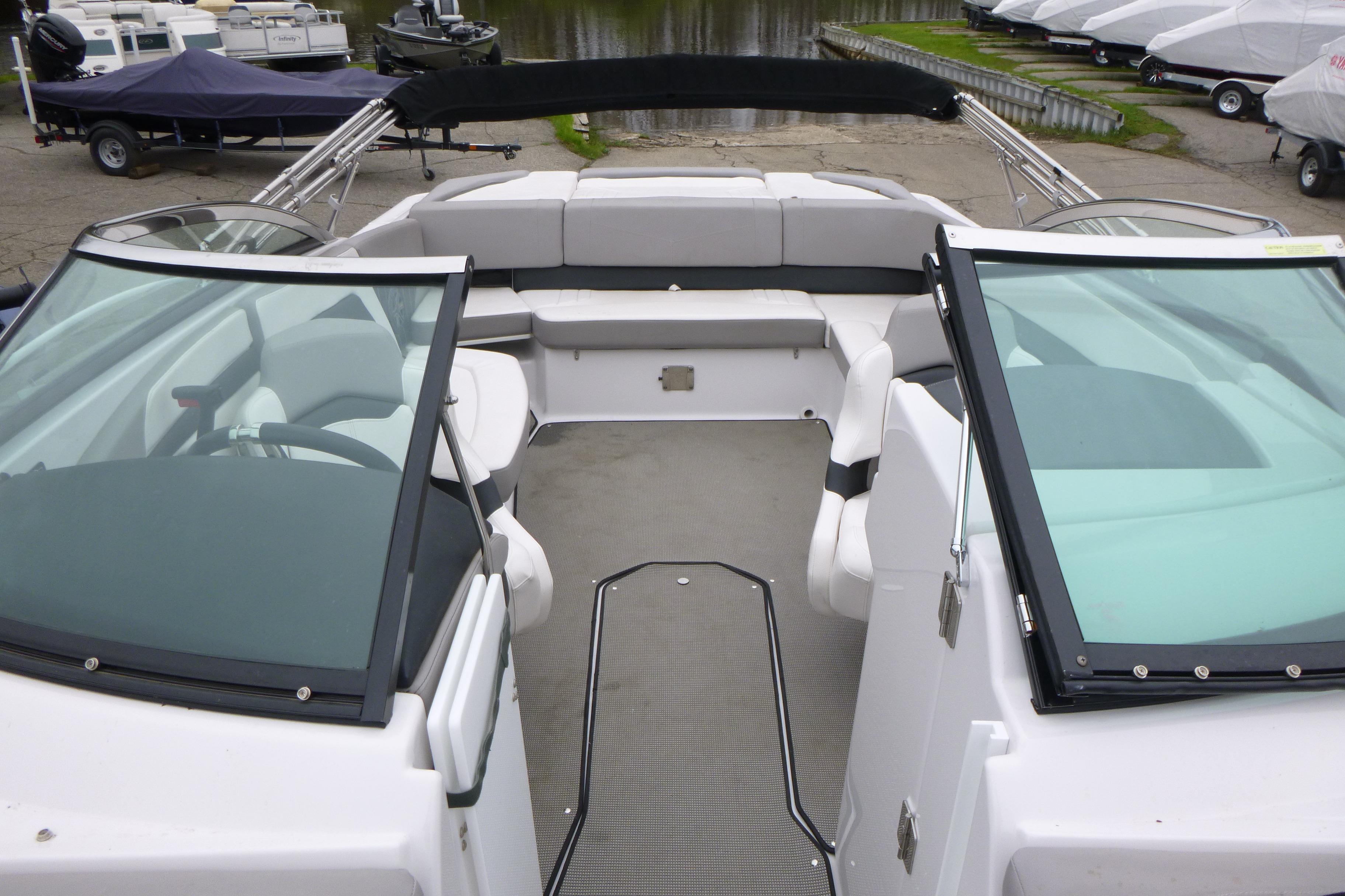 2017 Four Winns H260 boat interior with spacious seating and dual windshields.