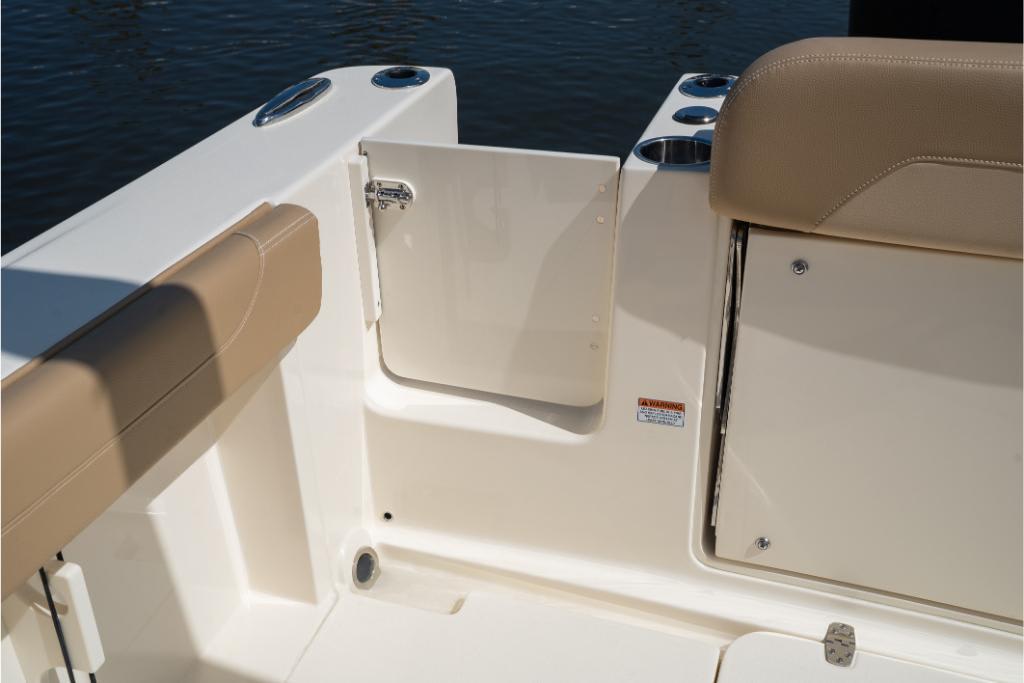 2023 Scout 240 Dorado boat interior with beige seating and storage compartment.