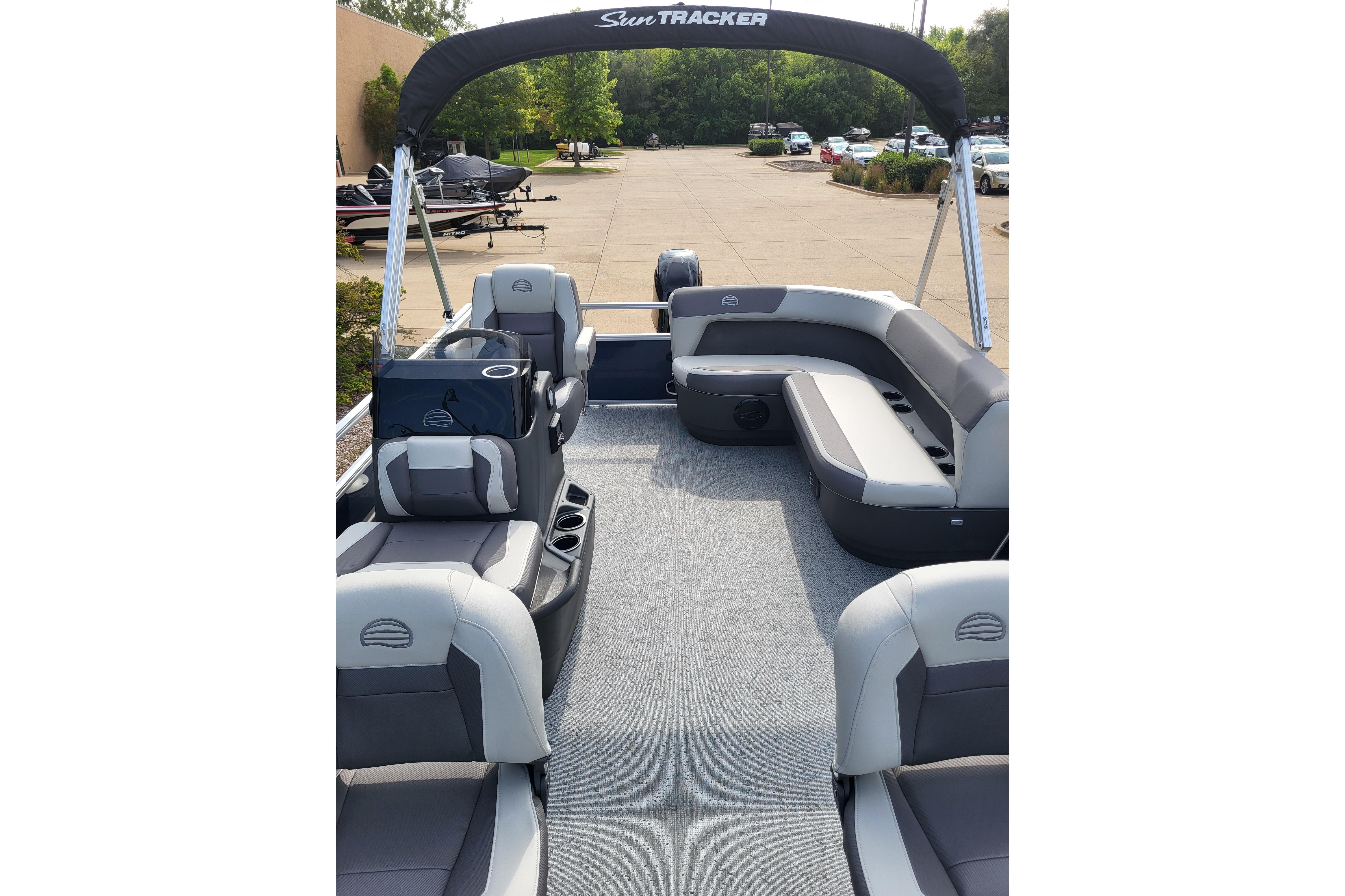 2026 Sun Tracker Bass Buggy 16 XL Select pontoon boat with spacious seating and modern design.