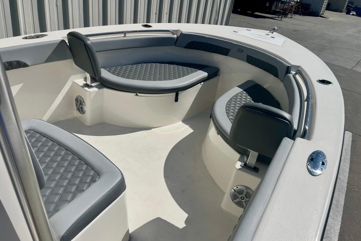 2025 Defiance Catalina 240 boat interior with cushioned seating and modern design.