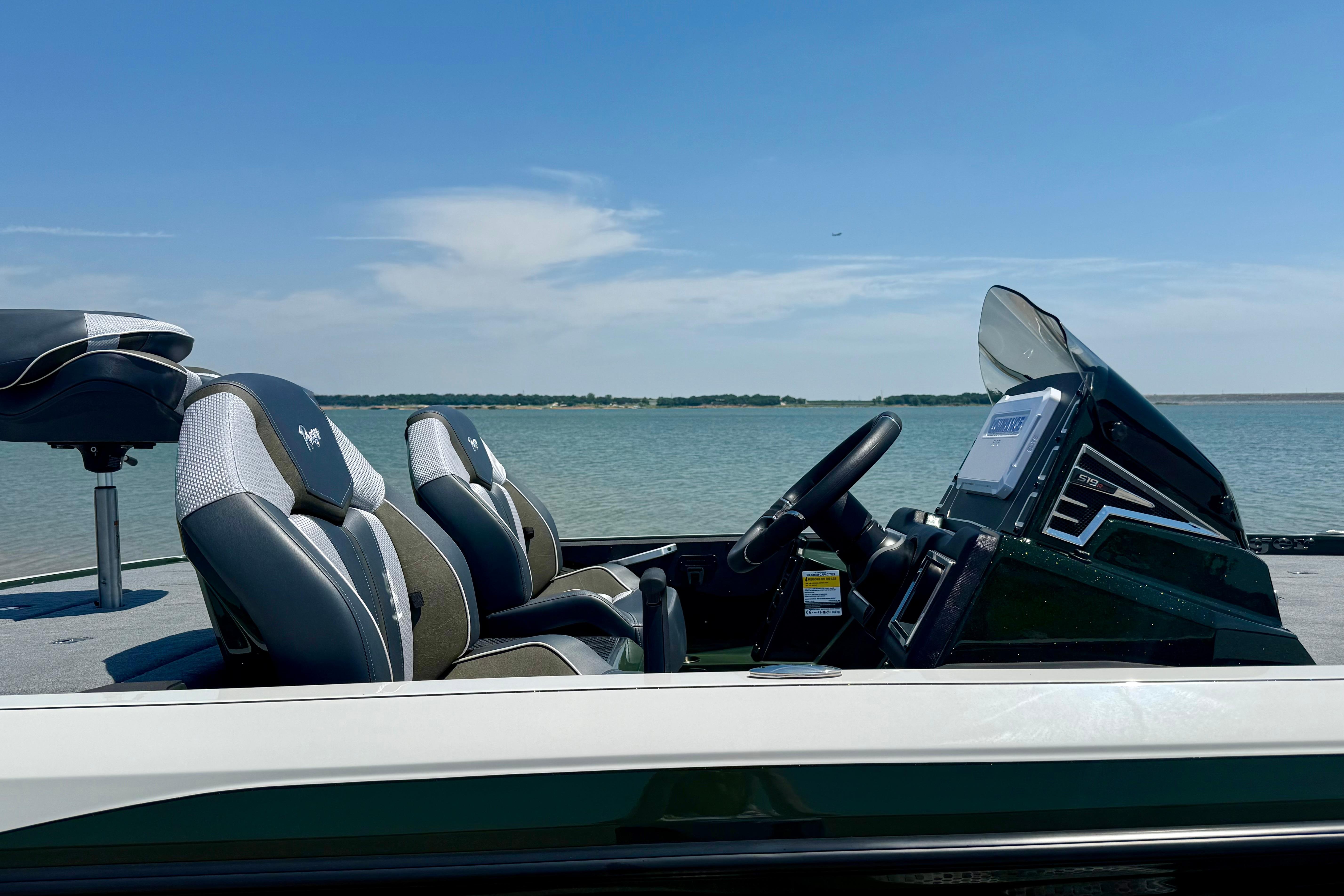 2026 Ranger Z519R boat interior with sleek seats, steering console, and lake view.