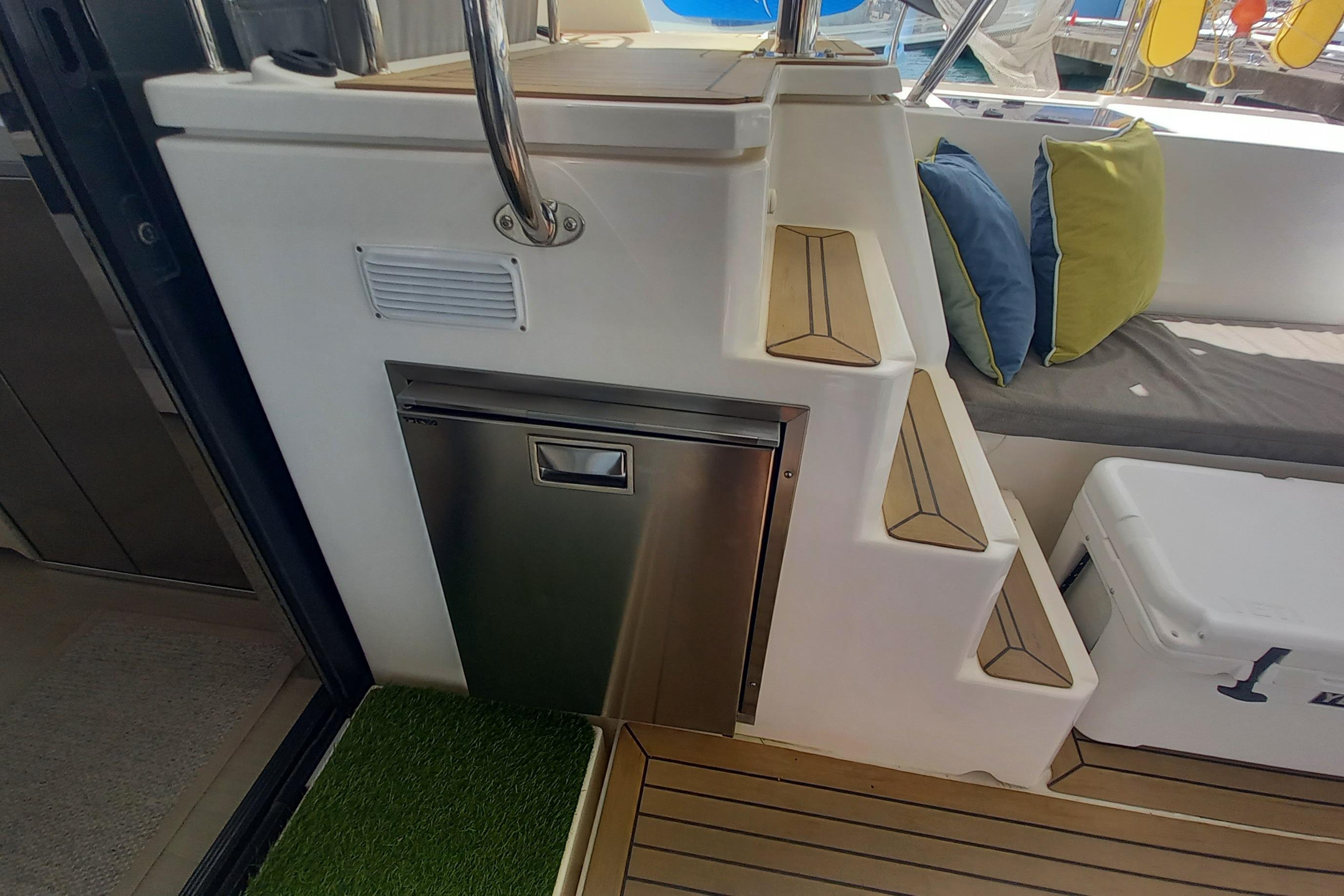Interior of 2019 Leopard 45 yacht with stairs, seating, and storage.