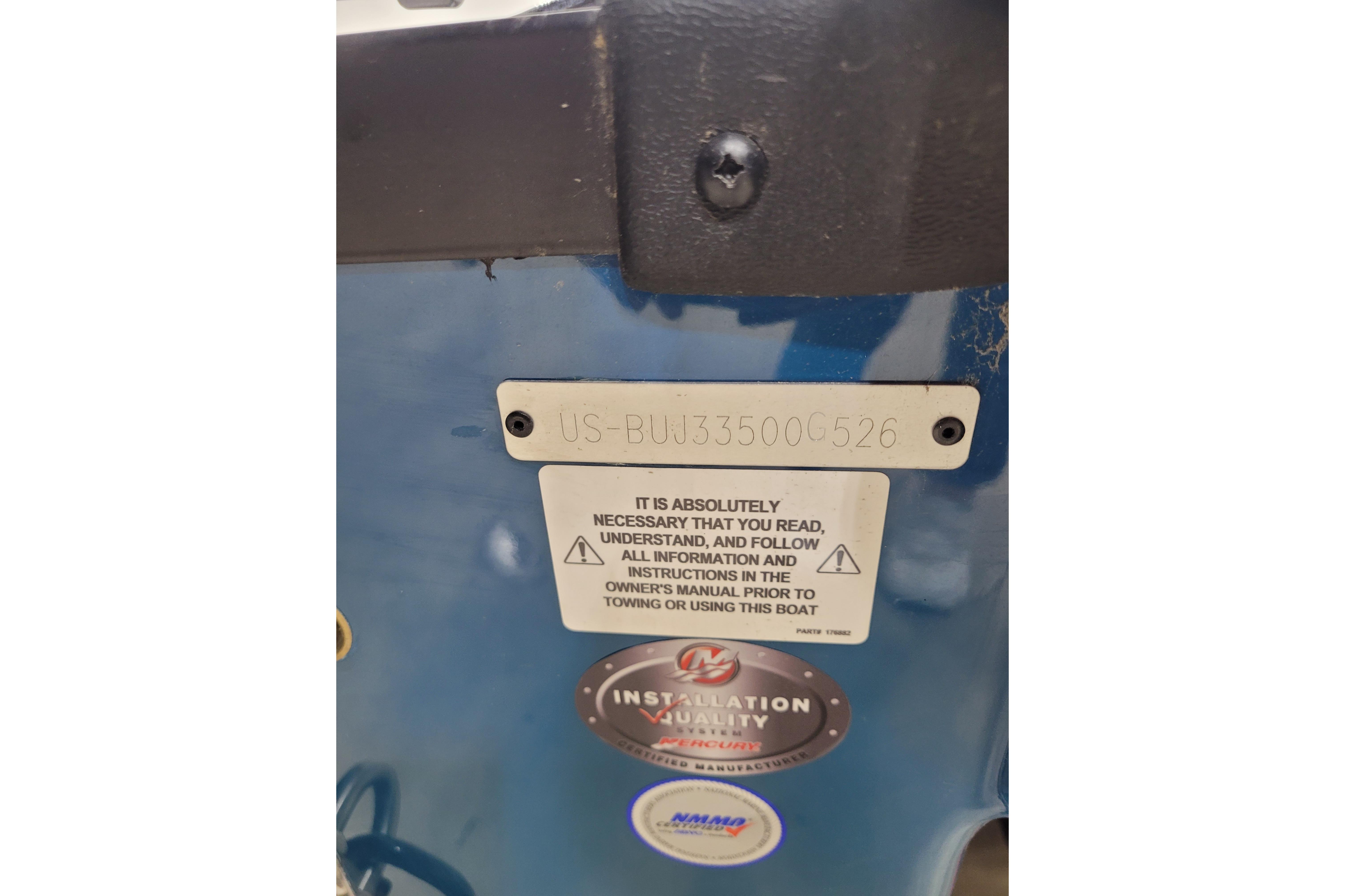 2026 Tahoe 2150 boat identification plate with safety instructions and serial number.