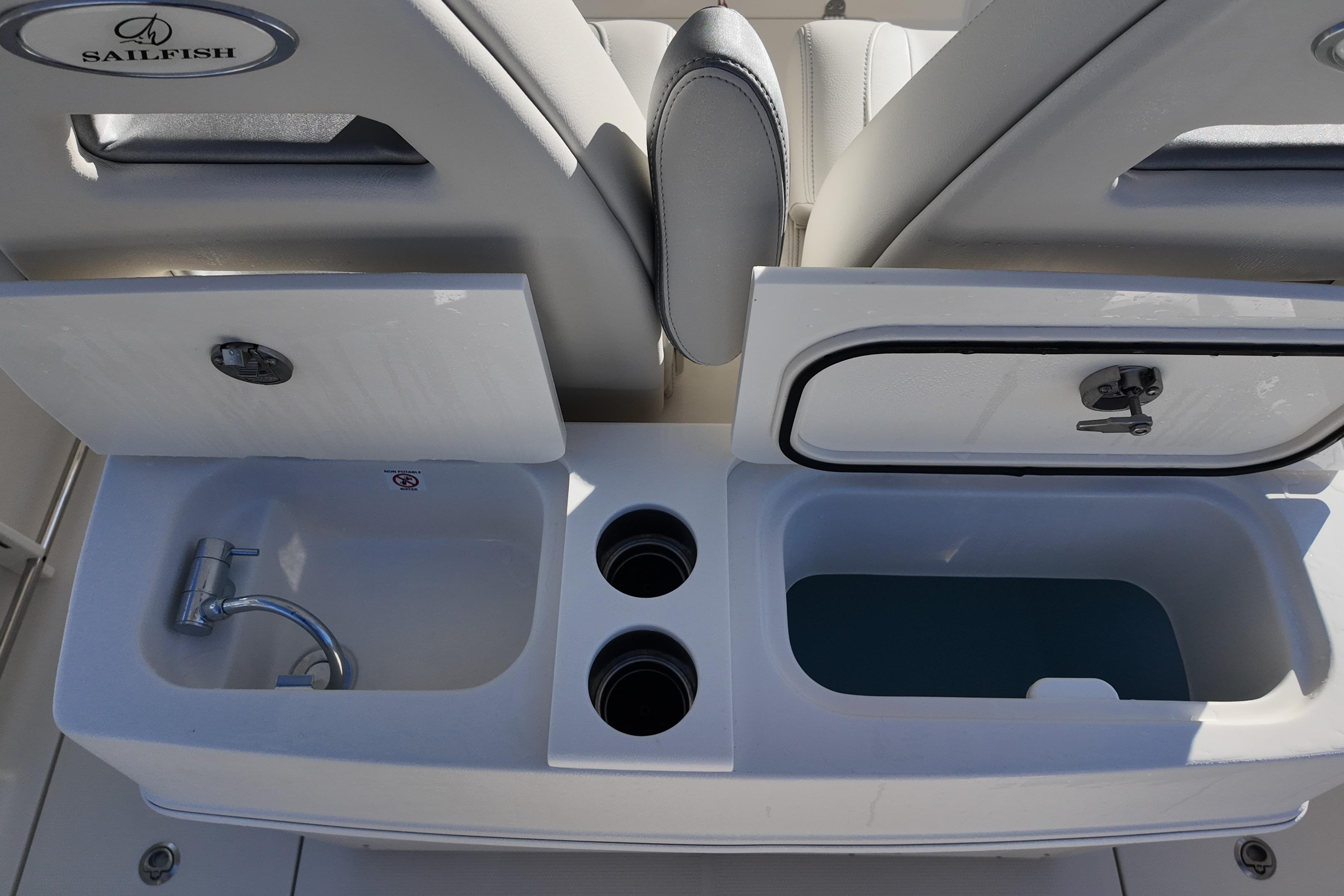 Sailfish 272 CC 2026 boat interior with sink and storage compartments.