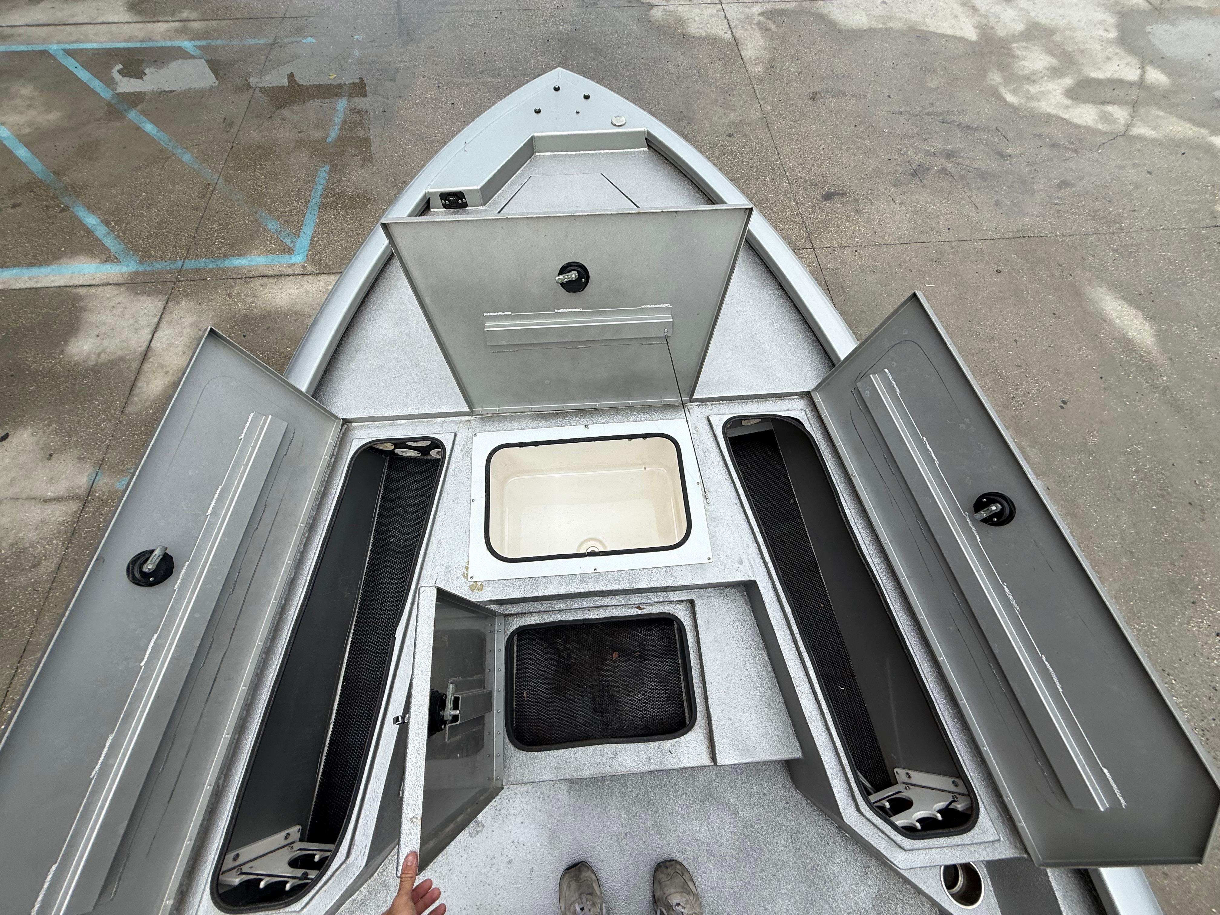 Avid 23 FS Platinum 2020 boat storage compartments open, showcasing interior layout.