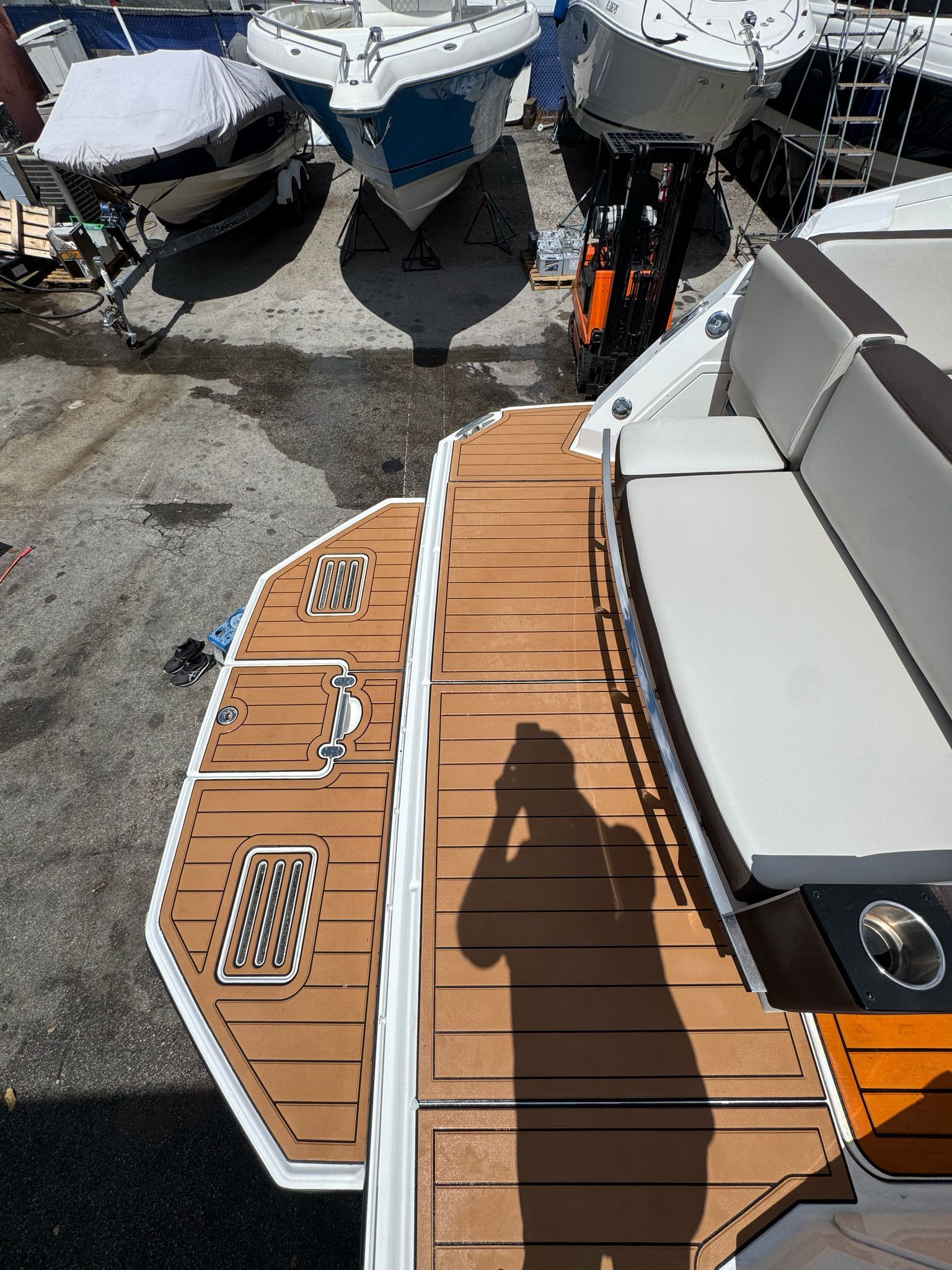 Monterey 360 Sport Coupe 2015 with teak deck in marina.
