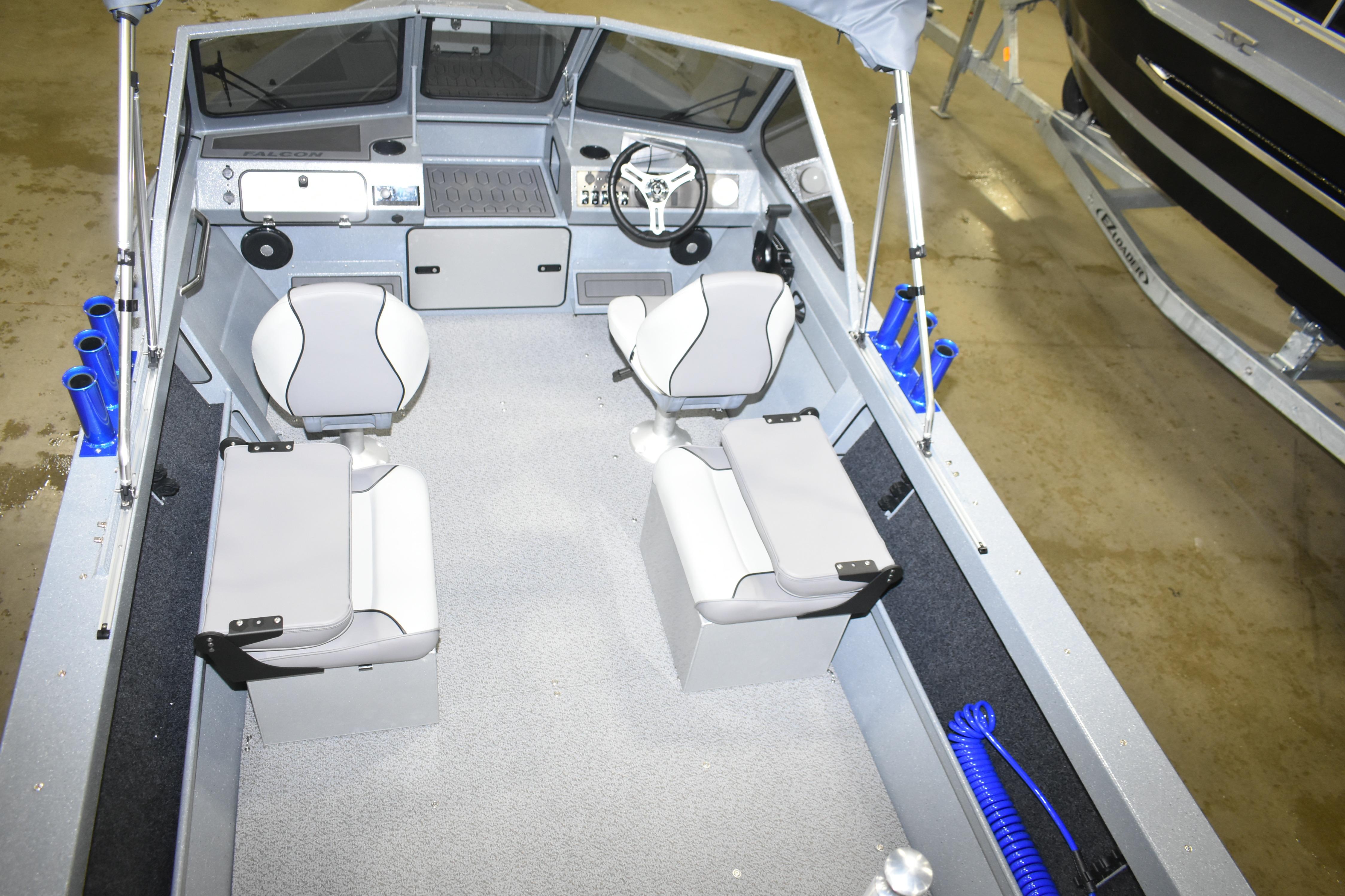 Interior of 2026 KingFisher 1825 Falcon boat with modern seating and steering console.