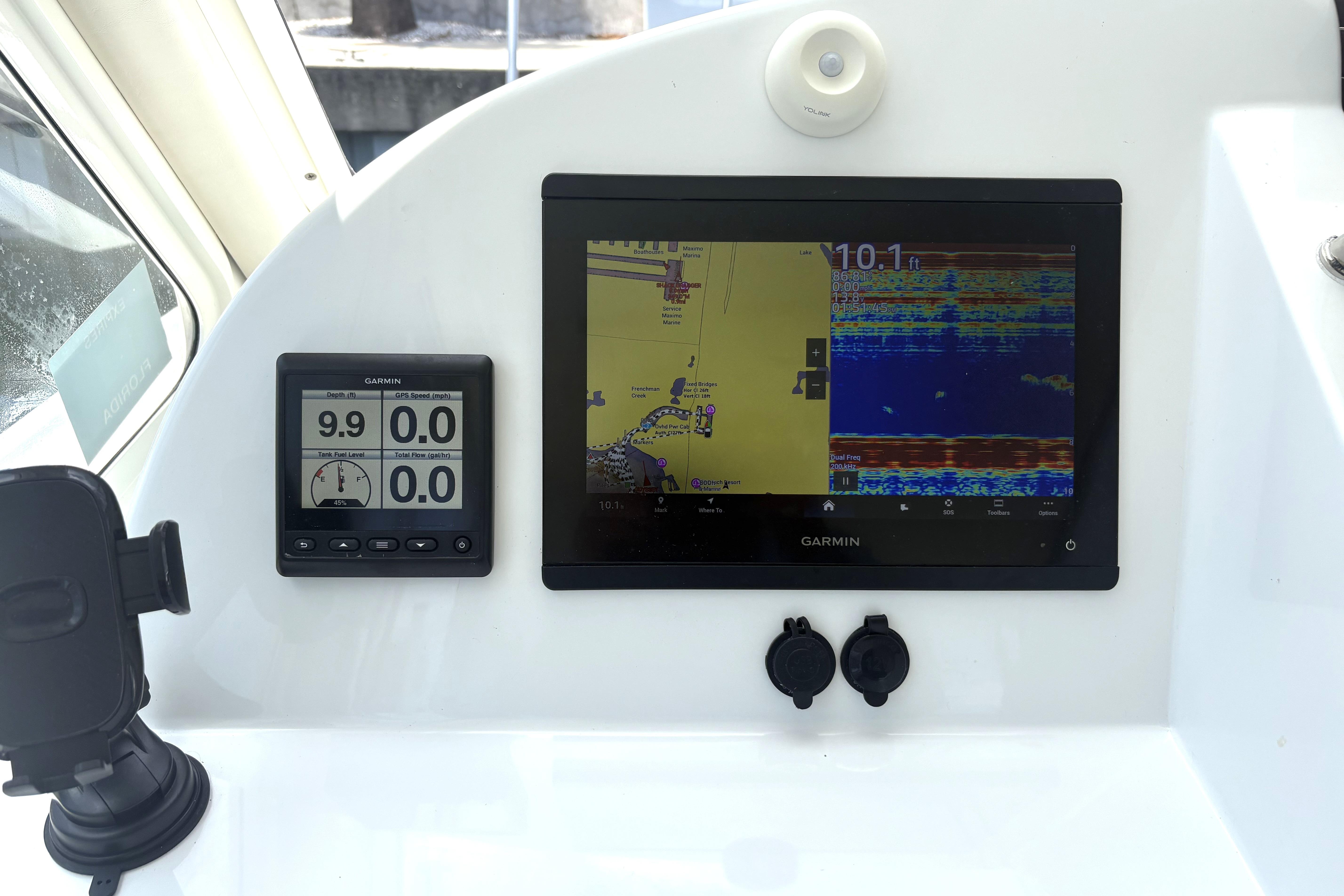 2024 MJM 35z boat dashboard with Garmin navigation and depth display.