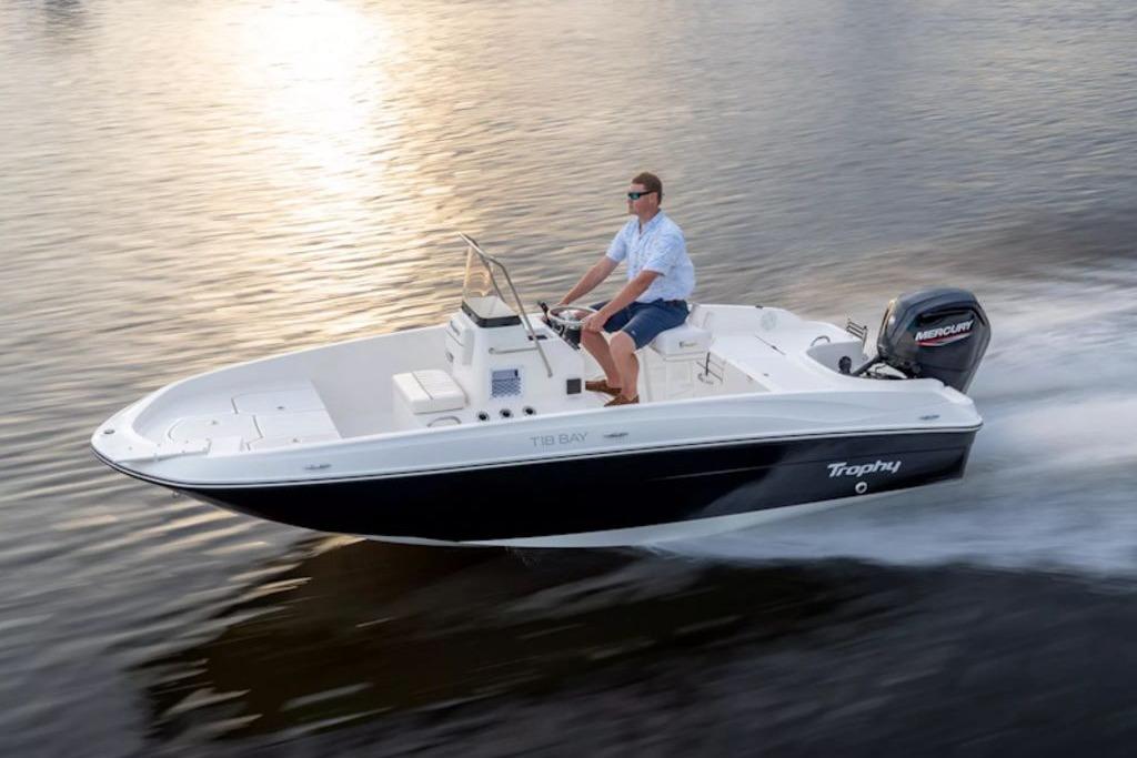 2026 Bayliner Trophy T18 boat cruising on calm water at sunset.