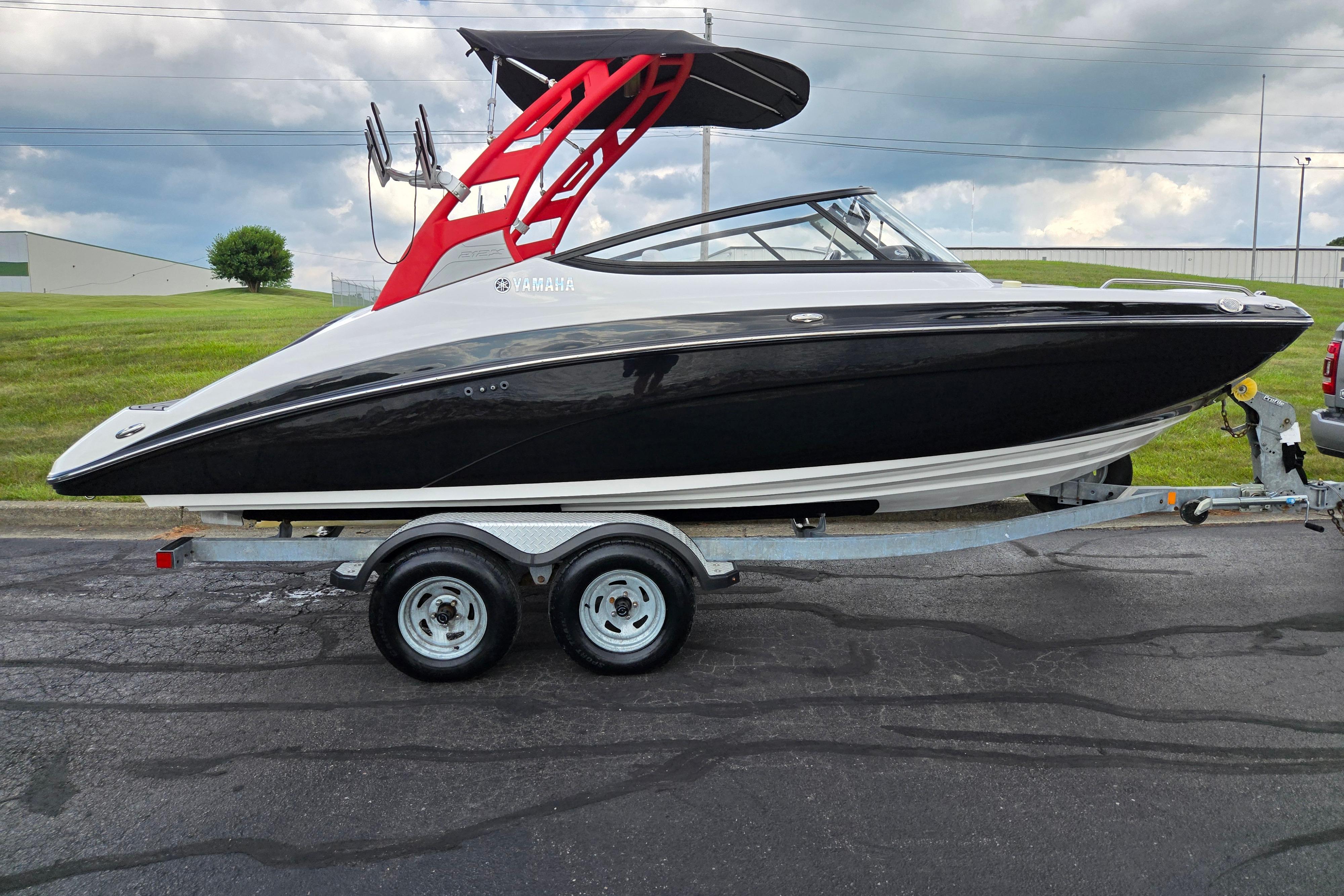 2018 Yamaha Boats 212X on trailer, black and white design, red wakeboard tower.