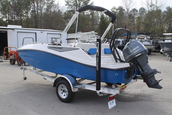 2025 Starcraft SV 16 OB boat with Yamaha outboard motor on trailer, parked outdoors.
