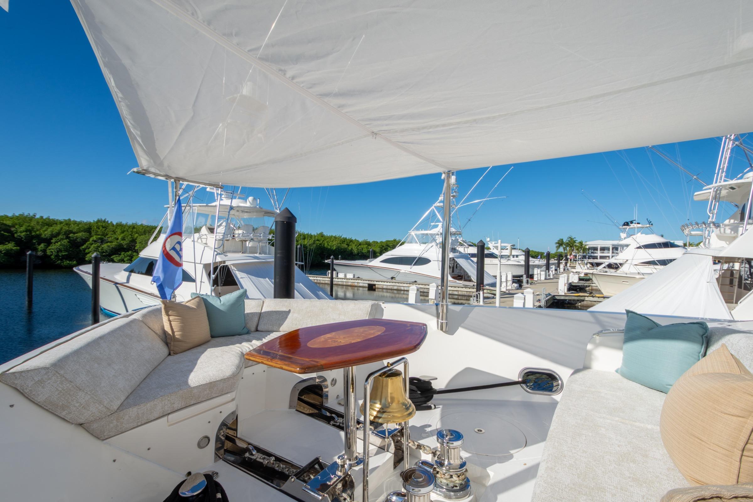 Luxurious 2014 Hargrave Sky Lounge yacht interior with plush seating and marina view.
