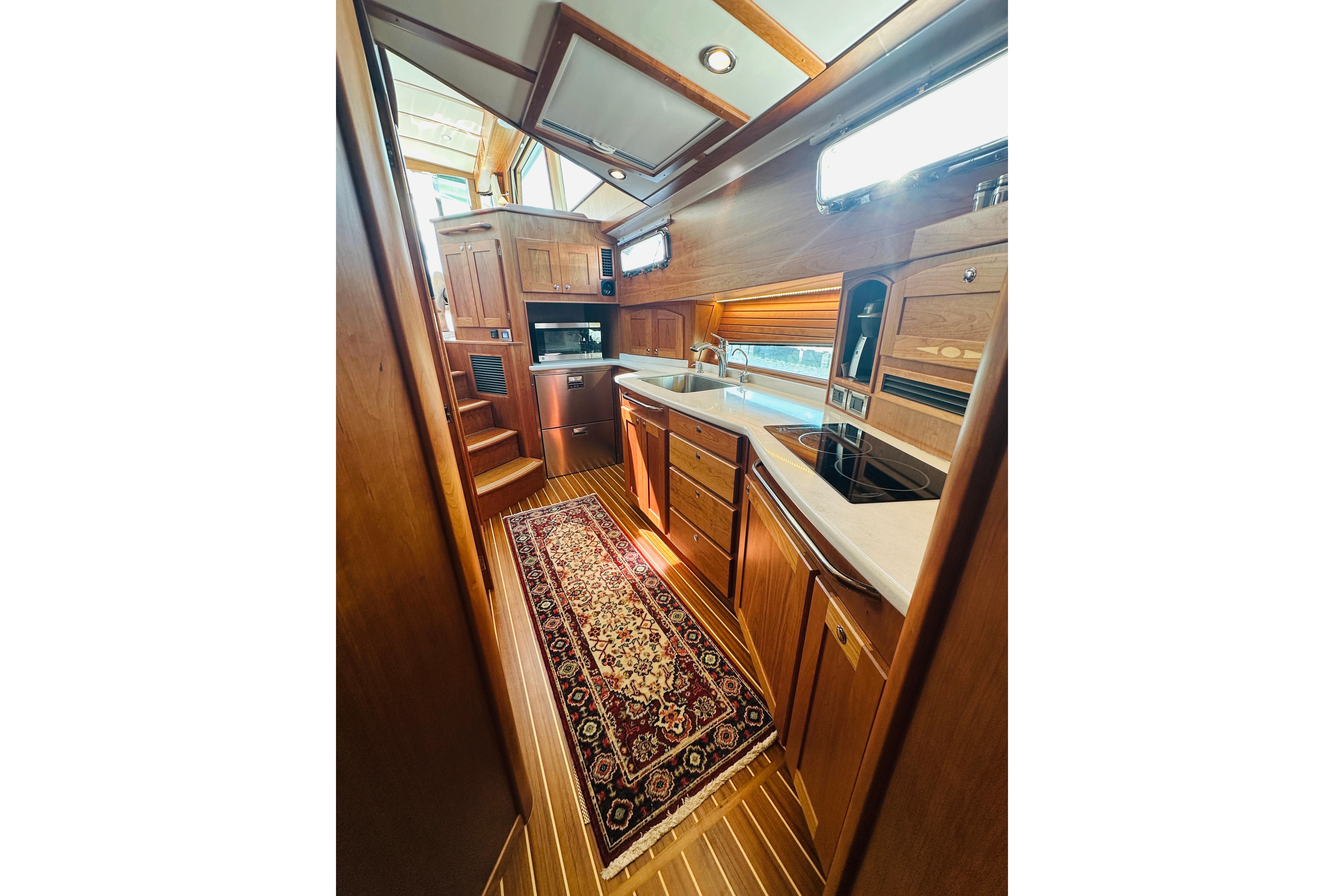 Luxurious interior of 2025 Sabre 48 Salon Express yacht with elegant wood finishes.