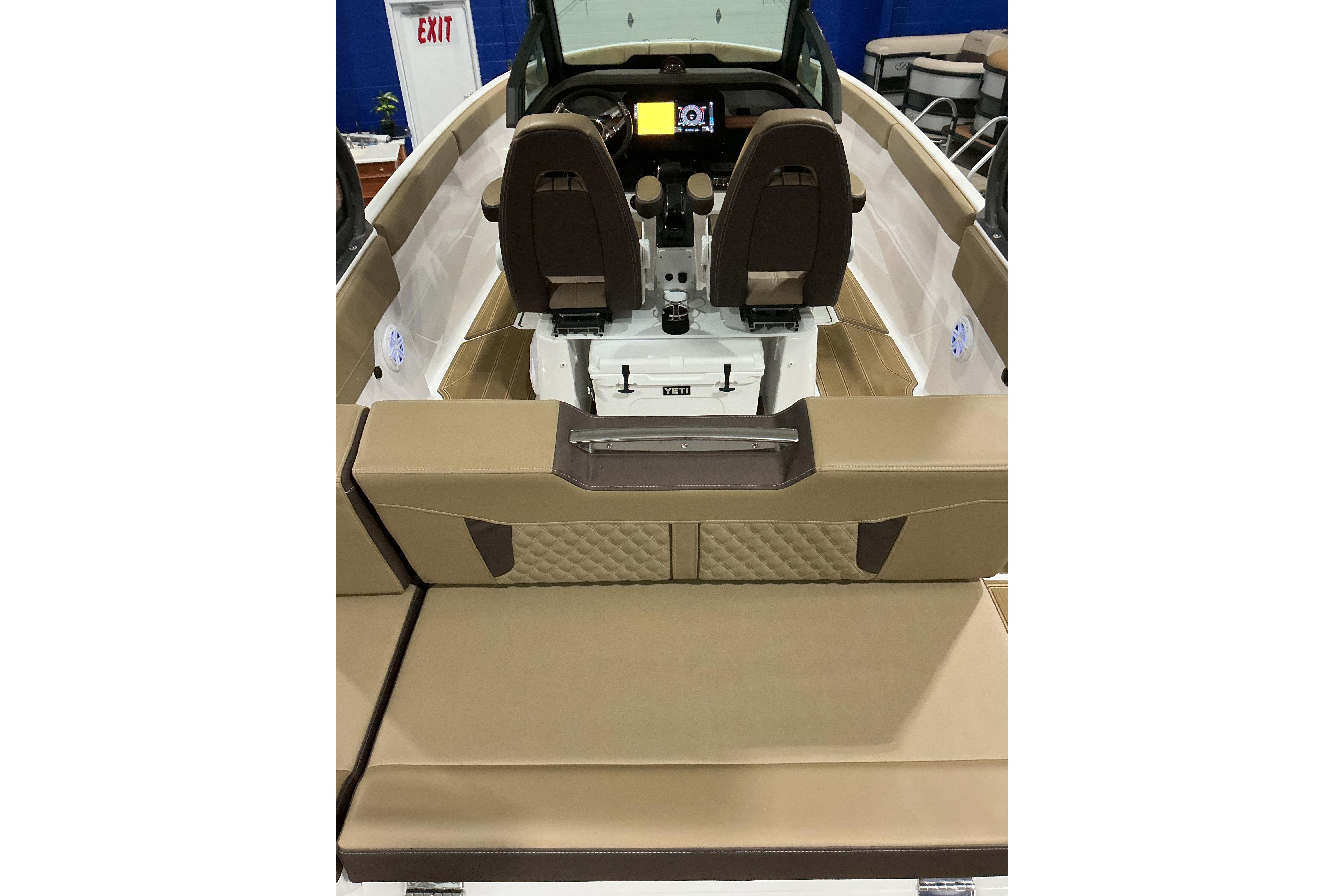 2026 Monterey Elite 25 SD boat interior with luxurious seating and modern dashboard.
