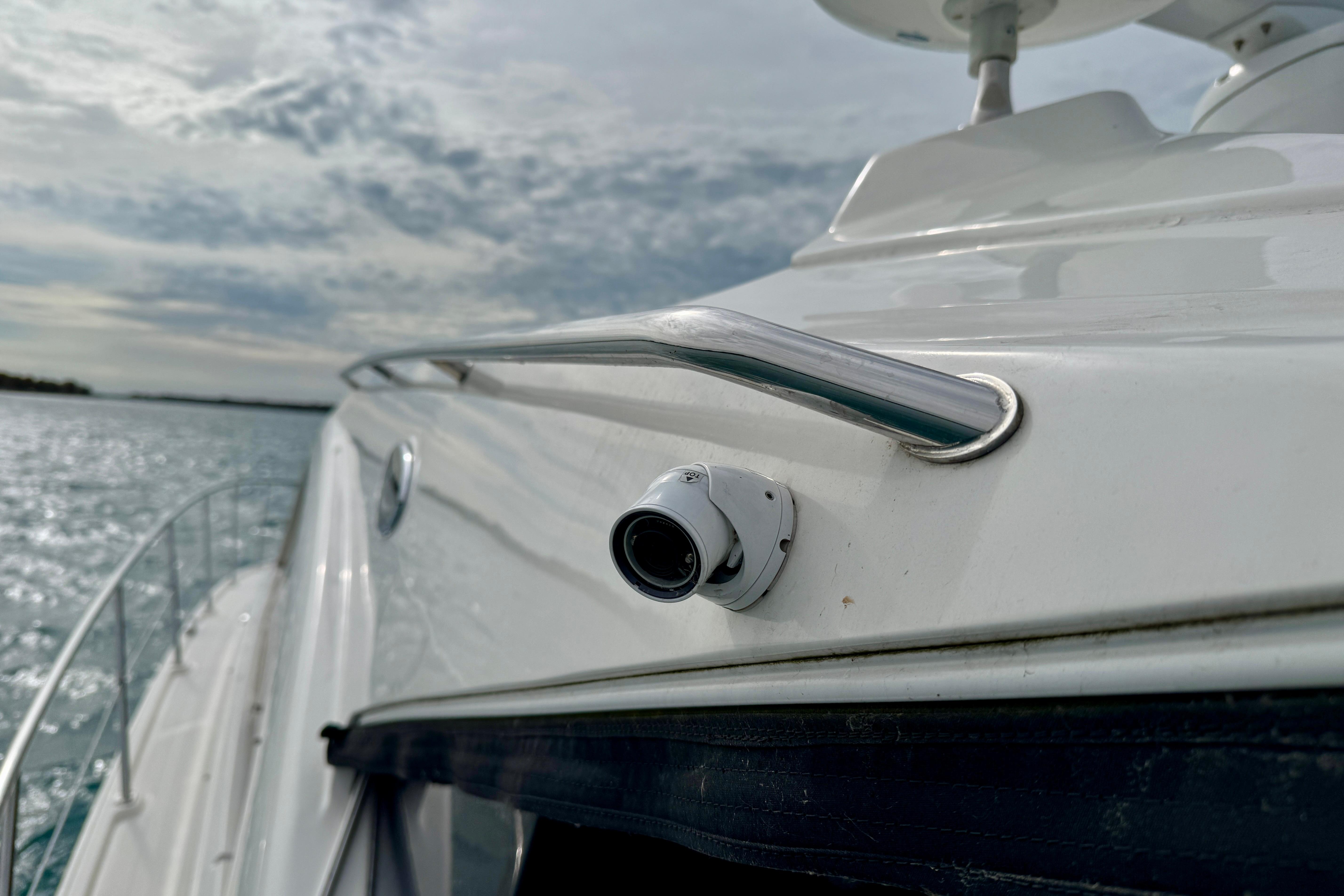 2014 Sea Ray 510 Sundancer yacht with camera, cruising on a sunny day.