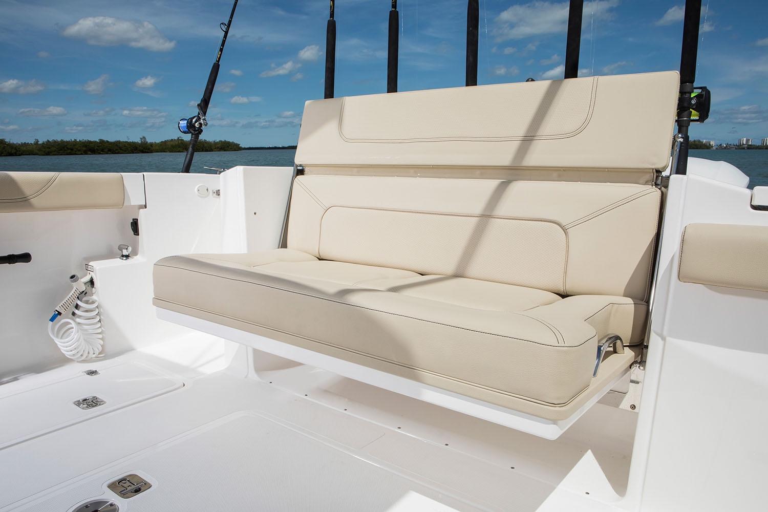 Manufacturer Provided Image: 2021 Pursuit S 328 Sport boat with beige seating and fishing rod holders.