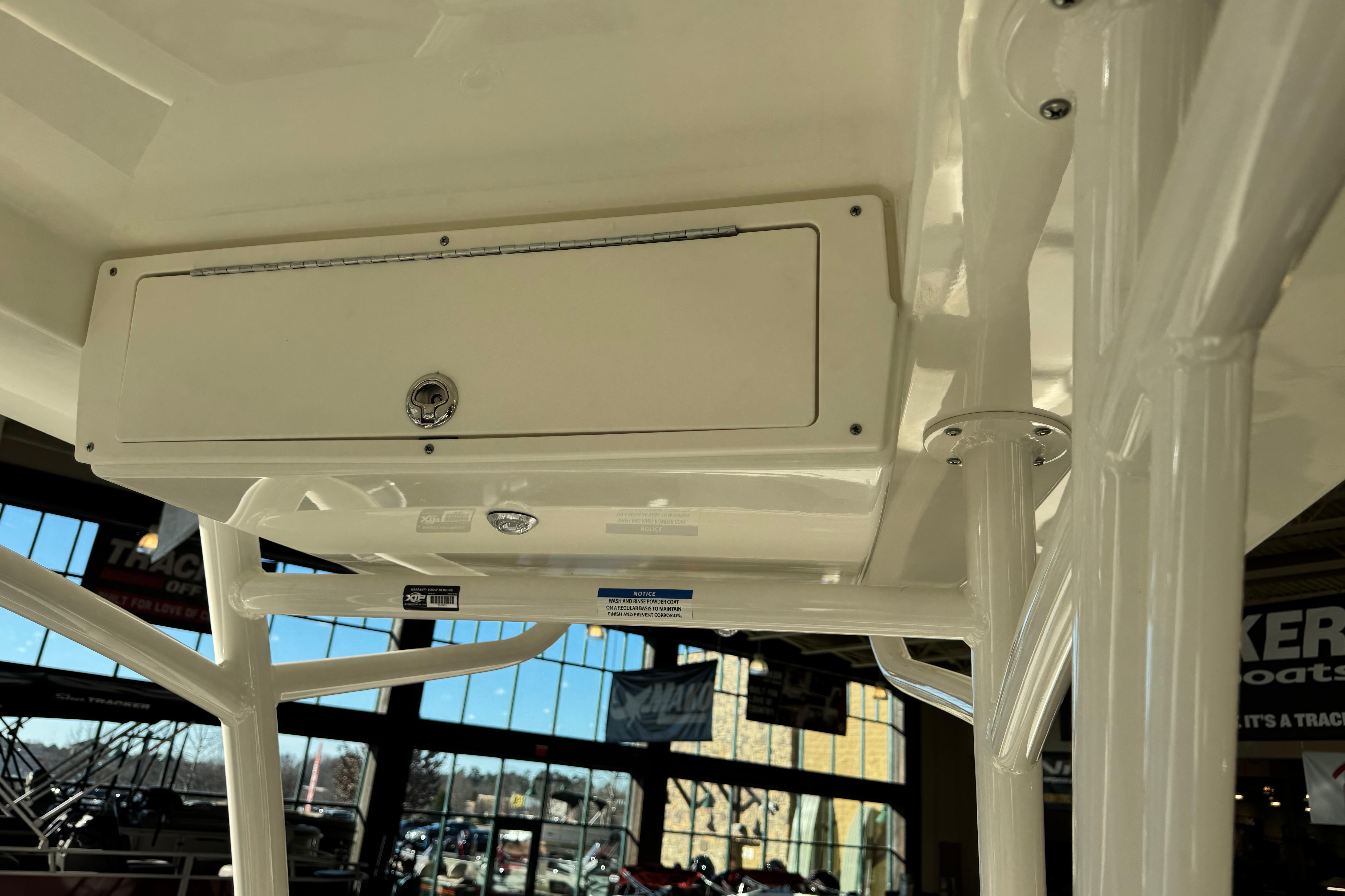 2026 Mako 24 APEX boat interior with storage compartment and sturdy framework.