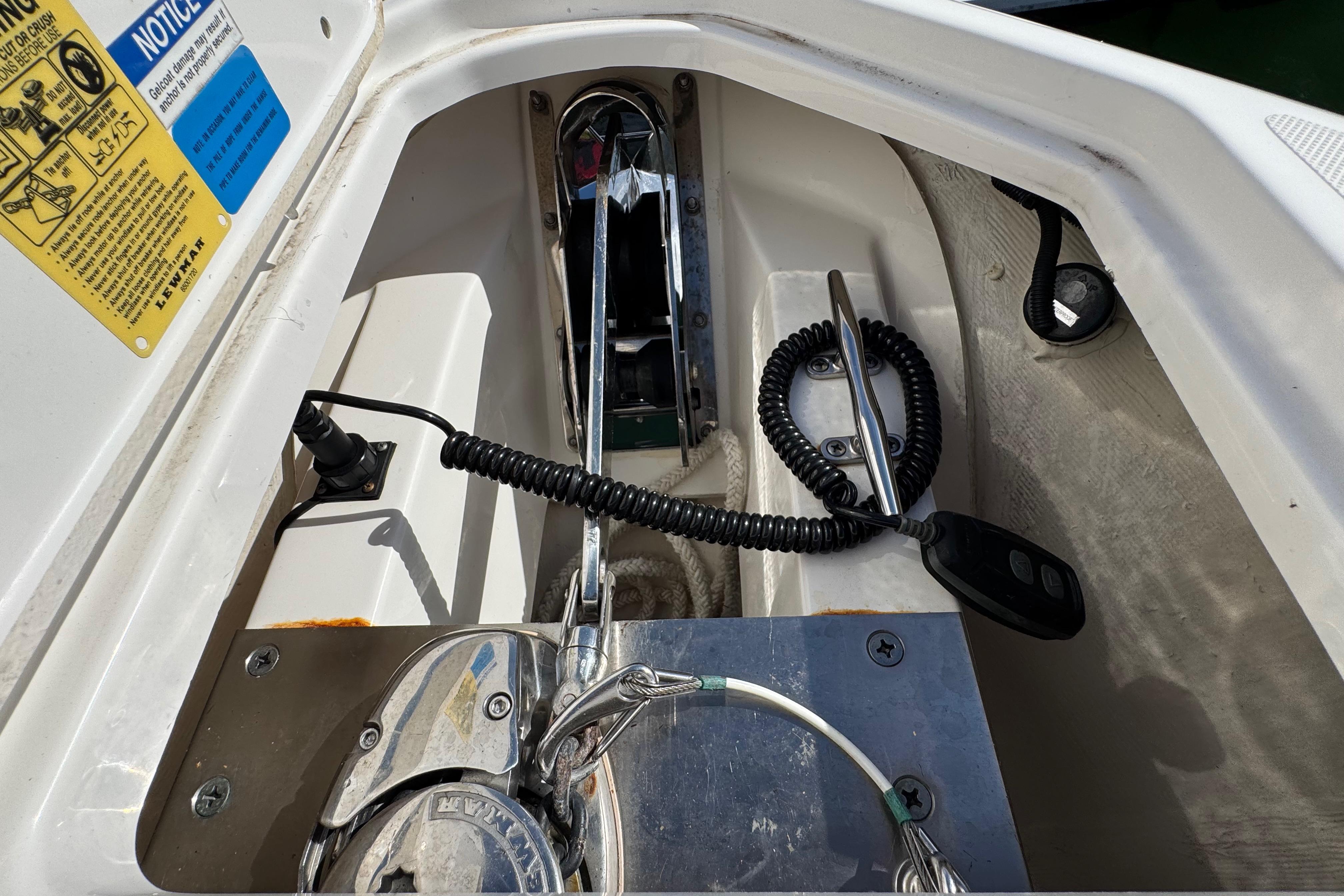 2022 Pursuit DC 266 Dual Console boat anchor compartment with control panel and wiring.