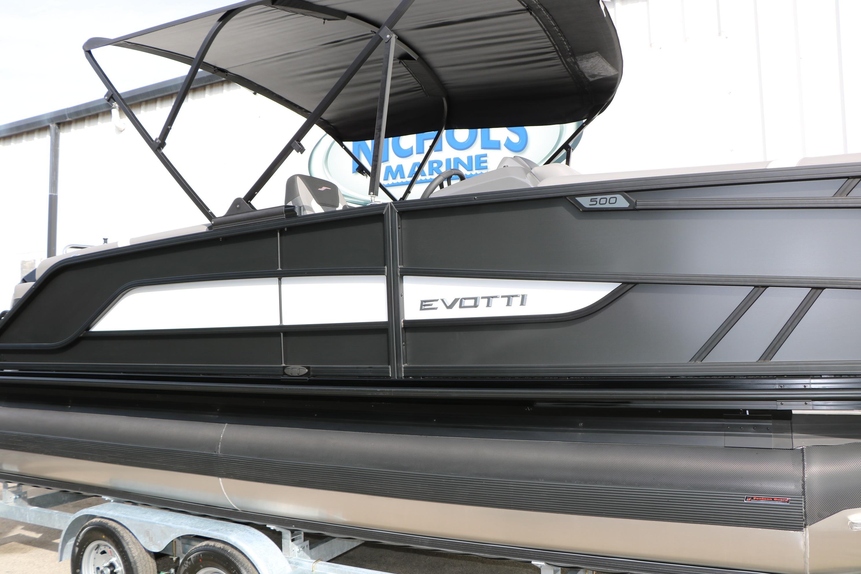 2026 Evotti 521QL boat with sleek black design and canopy, displayed on a trailer.