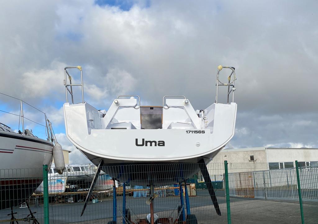 Sailboat "Uma" on dry dock, Elan E3 model, 2020, under cloudy sky.