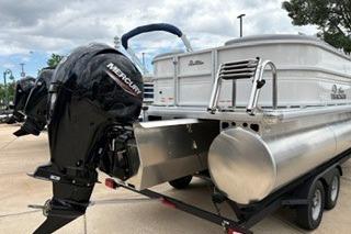 2026 Sun Tracker Party Barge 22 XP3 pontoon boat with Mercury outboard motor.