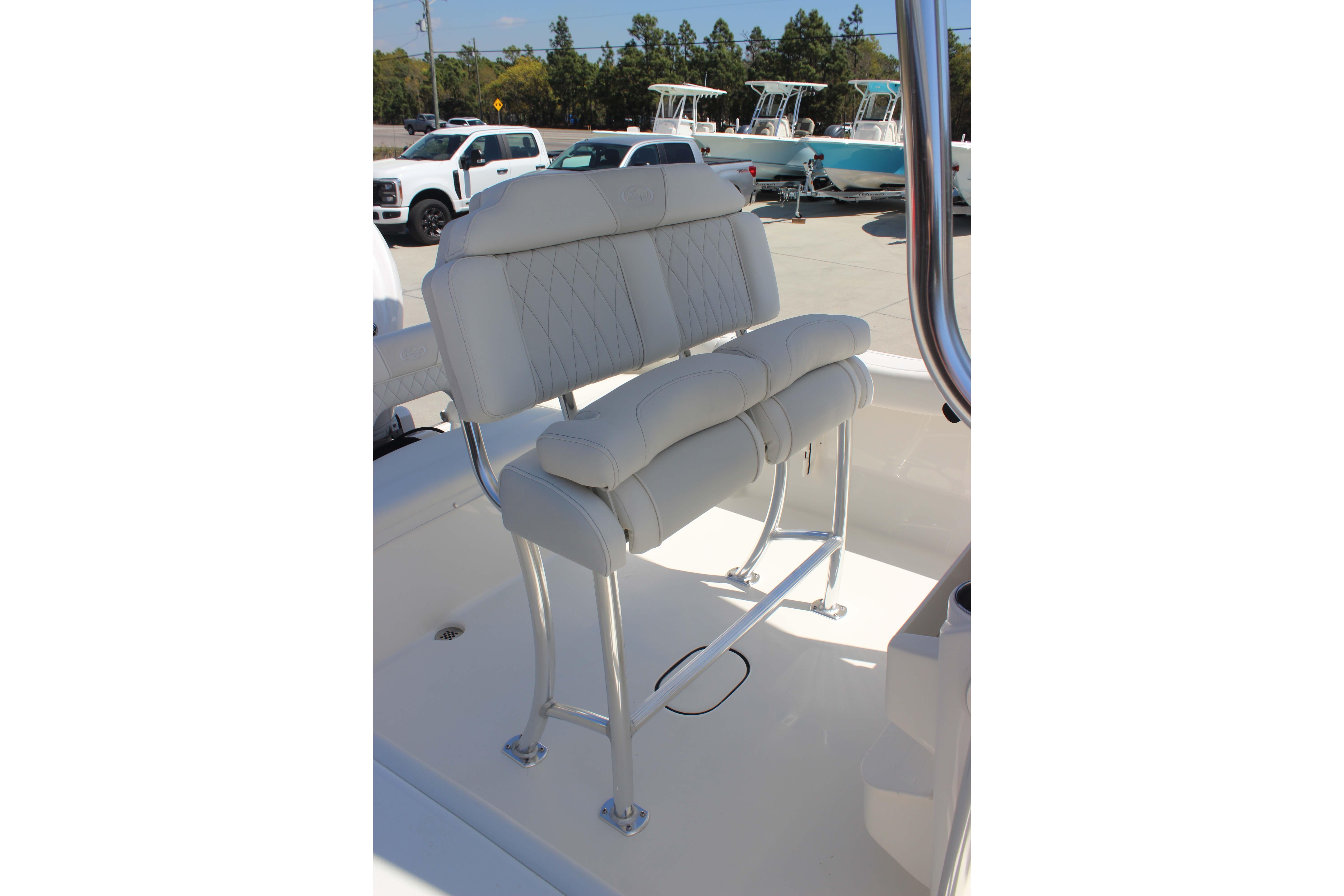 2026 Key West 203 FS boat with white cushioned seating and stainless steel frame.