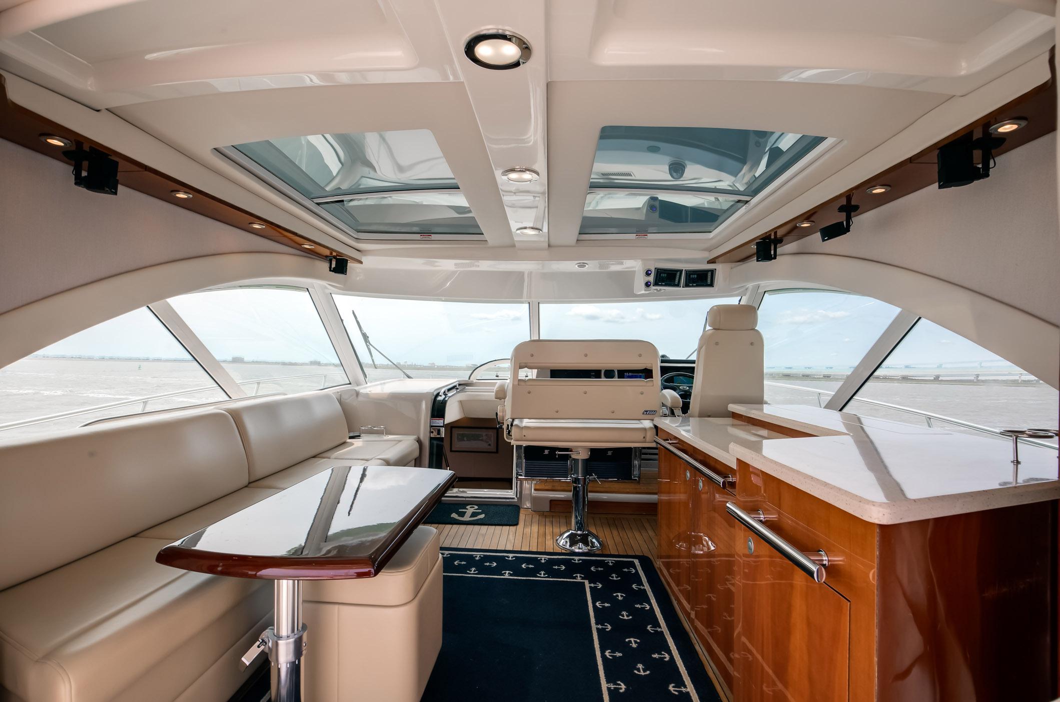 Luxurious interior of a 2008 Sea Ray 60 Sundancer yacht with elegant seating and panoramic windows.