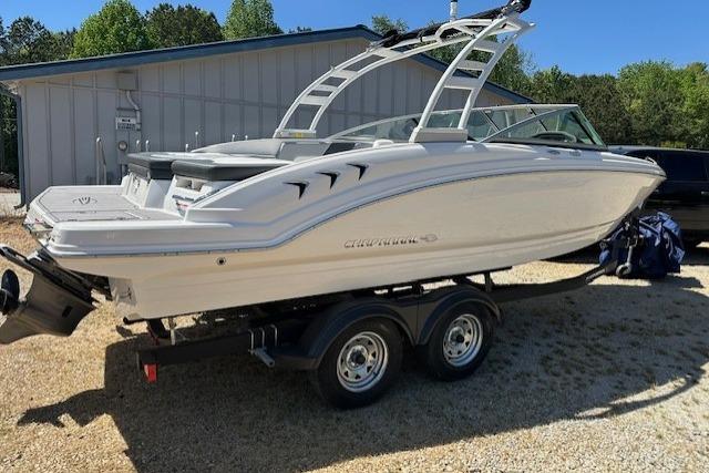 2023 Chaparral 23 SSi boat on trailer, parked outdoors near a building.